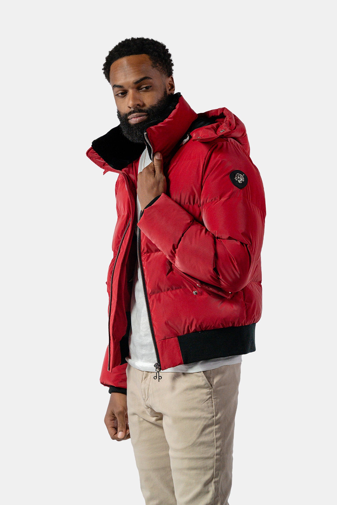 Woodpecker Men's Woody Bomber Winter coat. High-end Canadian designer winter coat for men in "Red Diamond" colour. Woodpecker cruelty-free winter coat designed in Canada. Men's heavy weight short length premium designer jacket for winter. Superior quality warm winter coat for men. Moose Knuckles, Canada Goose, Mackage, Montcler, Will Poho, Willbird, Nic Bayley. Shiny parka. Stylish winter jacket. Designer winter coat.