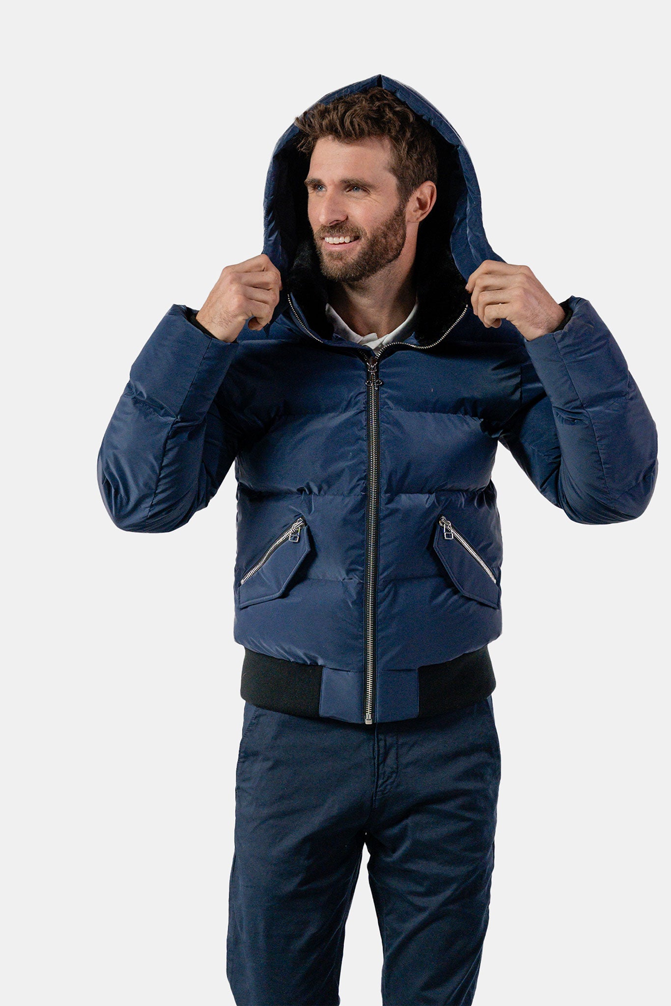 Woodpecker Men's Woody Bomber Winter coat. High-end Canadian designer winter coat for men in "Sapphire Diamond" colour. Woodpecker cruelty-free winter coat designed in Canada. Men's heavy weight short length premium designer jacket for winter. Superior quality warm winter coat for men. Moose Knuckles, Canada Goose, Mackage, Montcler, Will Poho, Willbird, Nic Bayley. Shiny parka. Stylish winter jacket. Designer winter coat.