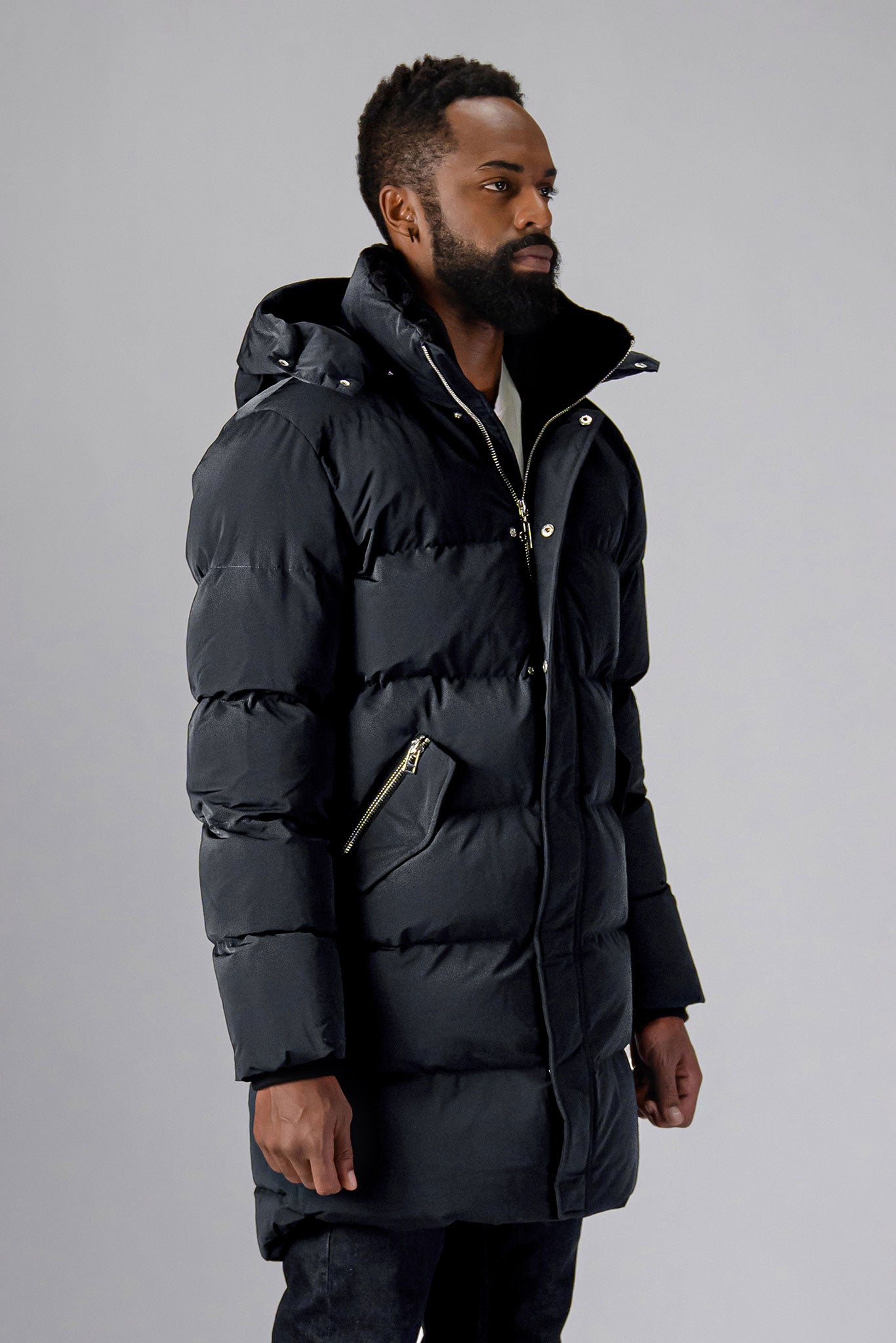 Woodpecker Men's Penguin Long Winter coat. High-end Canadian designer winter coat for men in "Black Diamond" colour. Woodpecker cruelty-free winter coat designed in Canada. Men's heavy weight long length premium designer jacket for winter. Superior quality warm winter coat for men. Moose Knuckles, Canada Goose, Mackage, Montcler, Will Poho, Willbird, Nic Bayley. Extra warm. Shiny parka. Stylish winter jacket. Designer winter coat.