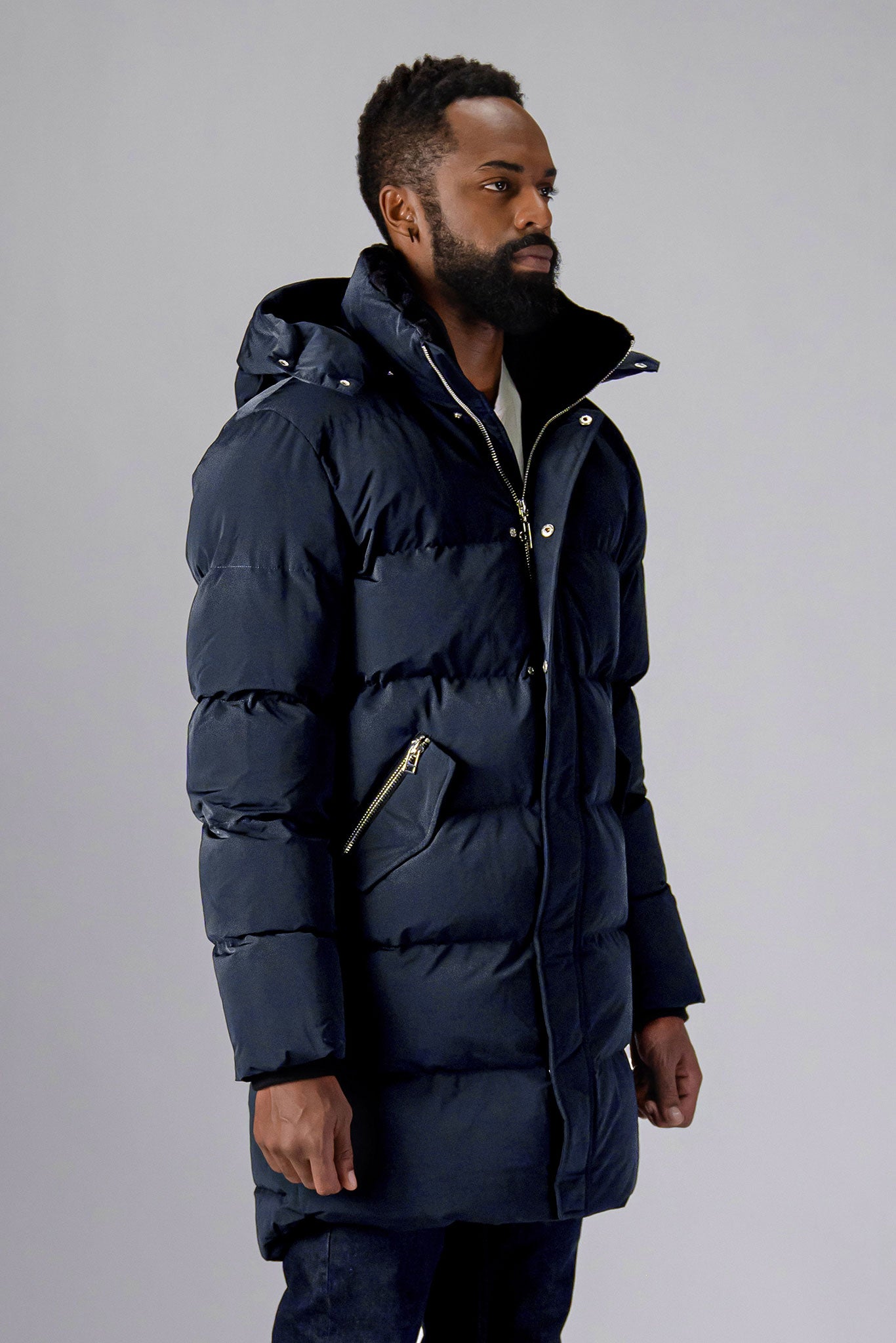 Woodpecker Men's Penguin Long Winter coat. High-end Canadian designer winter coat for men in "Blue Diamond" colour. Woodpecker cruelty-free winter coat designed in Canada. Men's heavy weight long length premium designer jacket for winter. Superior quality warm winter coat for men. Moose Knuckles, Canada Goose, Mackage, Montcler, Will Poho, Willbird, Nic Bayley. Extra warm. Shiny parka. Stylish winter jacket. Designer winter coat.