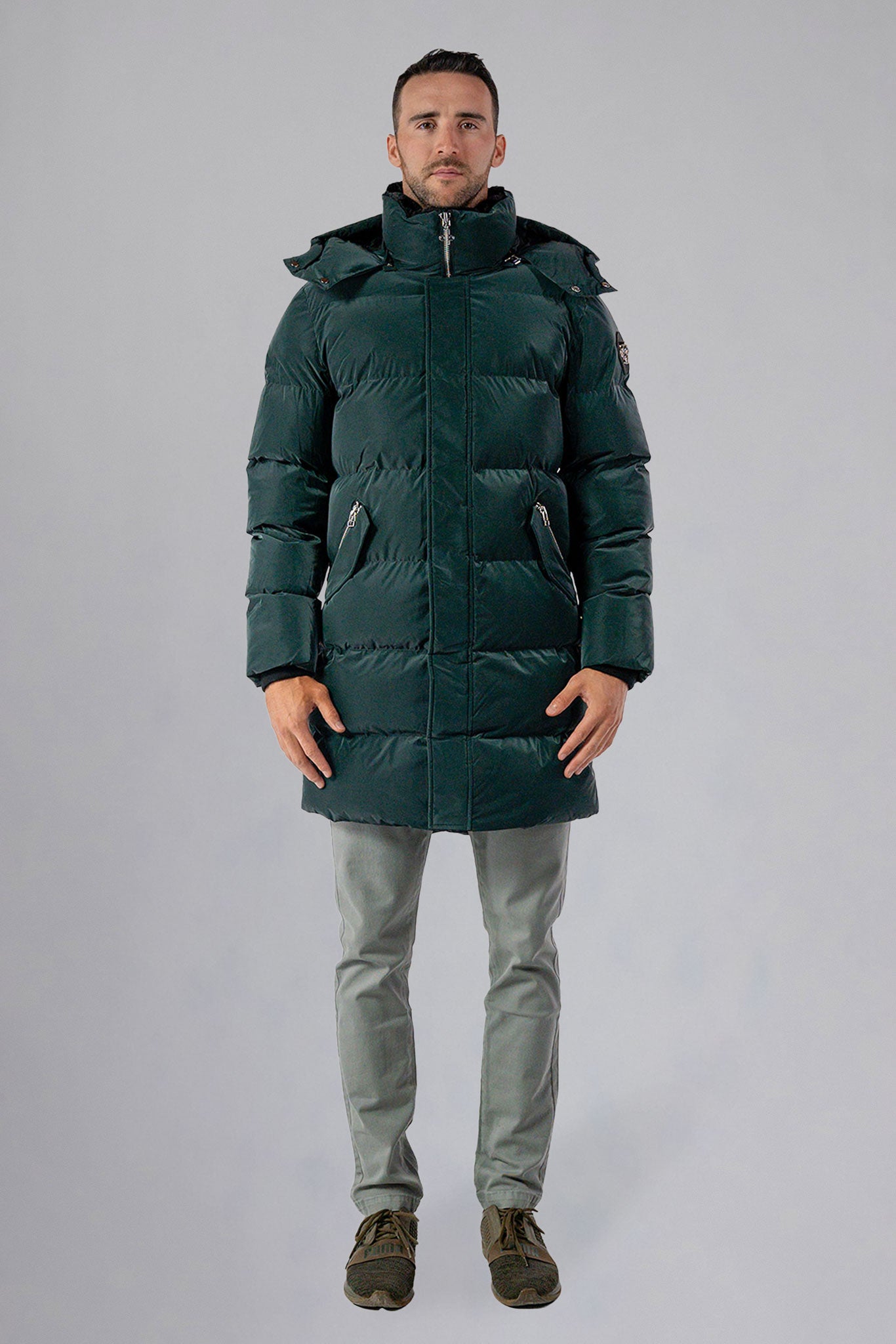 Woodpecker Men's Penguin Long Winter coat. High-end Canadian designer winter coat for men in "Green Diamond" navy blue colour. Woodpecker cruelty-free winter coat designed in Canada. Men's heavy weight long length premium designer jacket for winter. Superior quality warm winter coat for men. Moose Knuckles, Canada Goose, Mackage, Montcler, Will Poho, Willbird, Nic Bayley