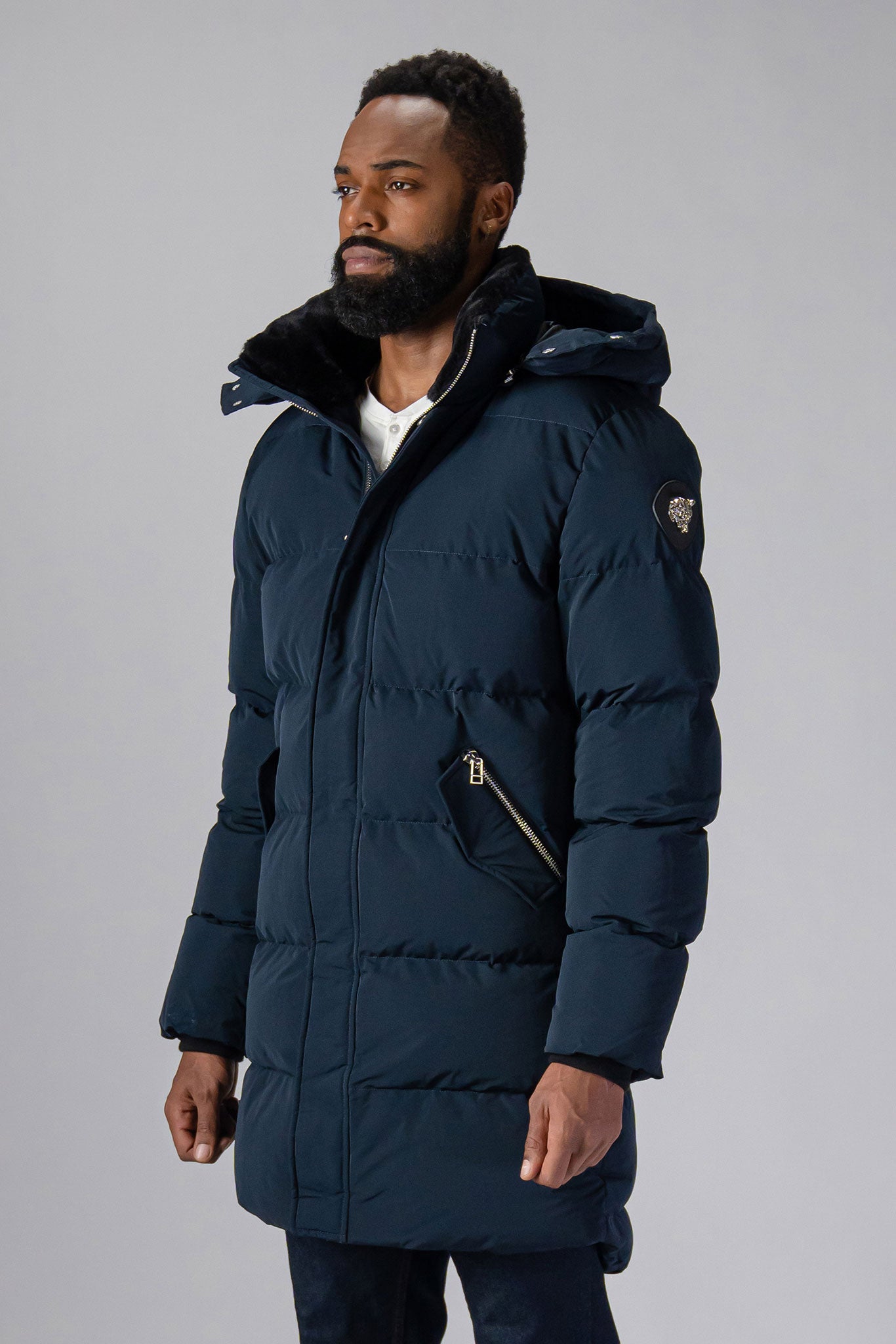 Woodpecker Men's Penguin Long Winter coat. High-end Canadian designer winter coat for men in “Matte Navy" colour. Woodpecker cruelty-free winter coat designed in Canada. Men's heavy weight long length premium designer jacket for winter. Superior quality warm winter coat for men. Moose Knuckles, Canada Goose, Mackage, Montcler, Will Poho, Willbird, Nic Bayley. Extra warm. Shiny parka. Stylish winter jacket. Designer winter coat.