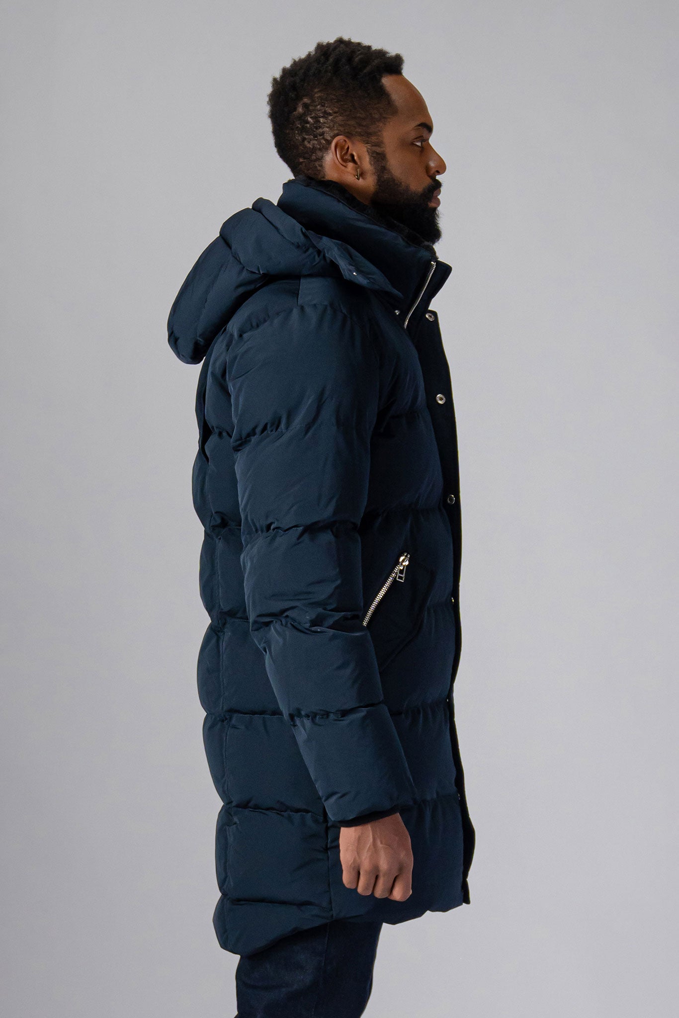 Woodpecker Men's Penguin Long Winter coat. High-end Canadian designer winter coat for men in “Matte Navy" colour. Woodpecker cruelty-free winter coat designed in Canada. Men's heavy weight long length premium designer jacket for winter. Superior quality warm winter coat for men. Moose Knuckles, Canada Goose, Mackage, Montcler, Will Poho, Willbird, Nic Bayley. Extra warm. Shiny parka. Stylish winter jacket. Designer winter coat.