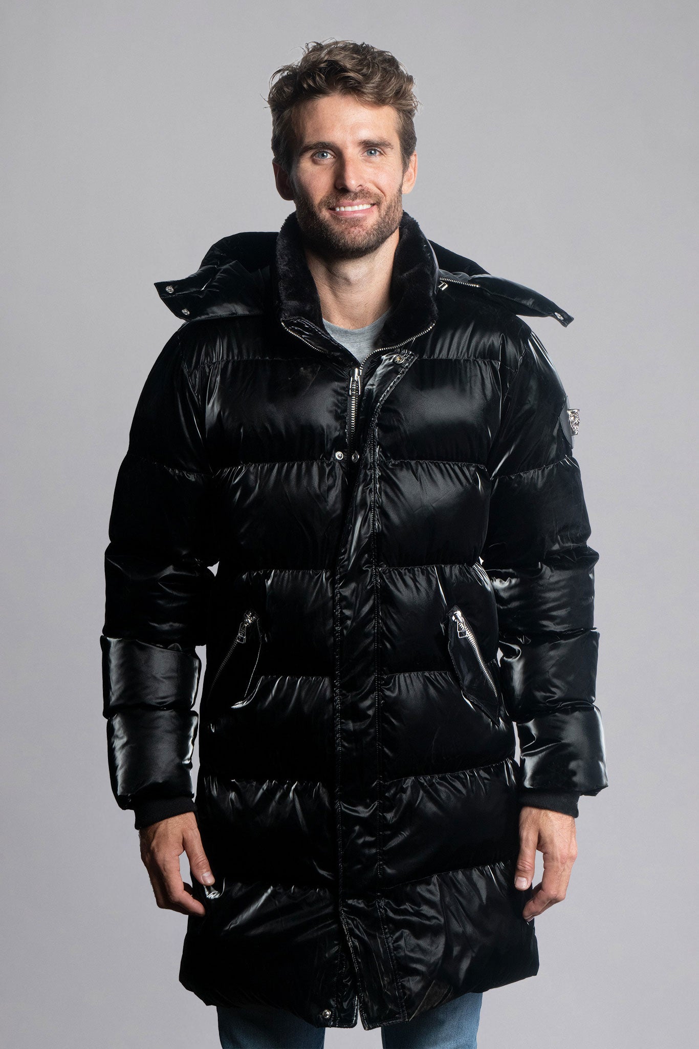 Woodpecker Men's Penguin Long Winter coat. High-end Canadian designer winter coat for men in shiny "All Wet Black" colour. Woodpecker cruelty-free winter coat designed in Canada. Men's heavy weight long length premium designer jacket for winter. Superior quality warm winter coat for men. Moose Knuckles, Canada Goose, Mackage, Montcler, Will Poho, Willbird, Nic Bayley
