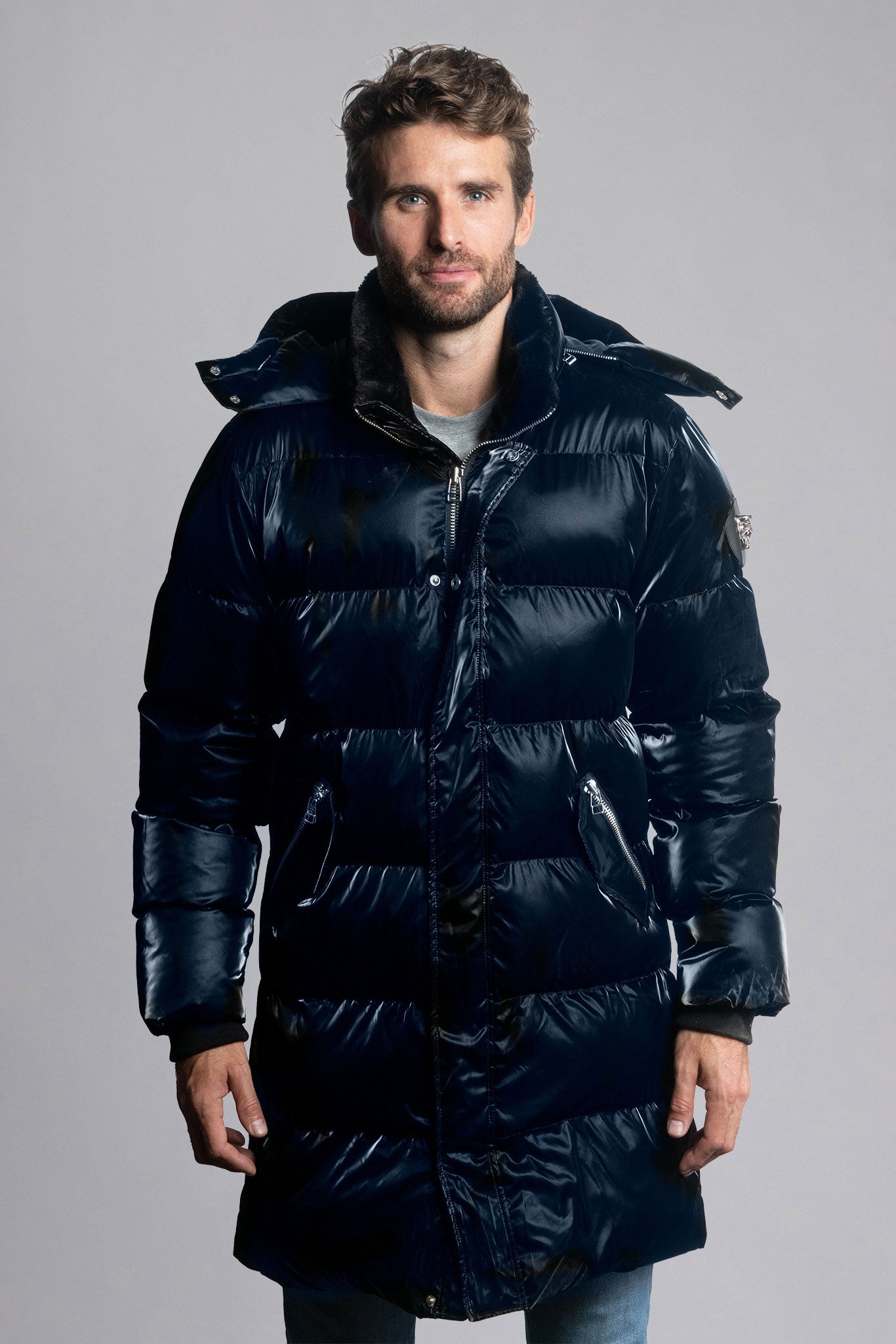 Woodpecker Men's Penguin Long Winter coat. High-end Canadian designer winter coat for men in shiny "All Wet Blue" navy blue colour. Woodpecker cruelty-free winter coat designed in Canada. Men's heavy weight long length premium designer jacket for winter. Superior quality warm winter coat for men. Moose Knuckles, Canada Goose, Mackage, Montcler, Will Poho, Willbird, Nic Bayley