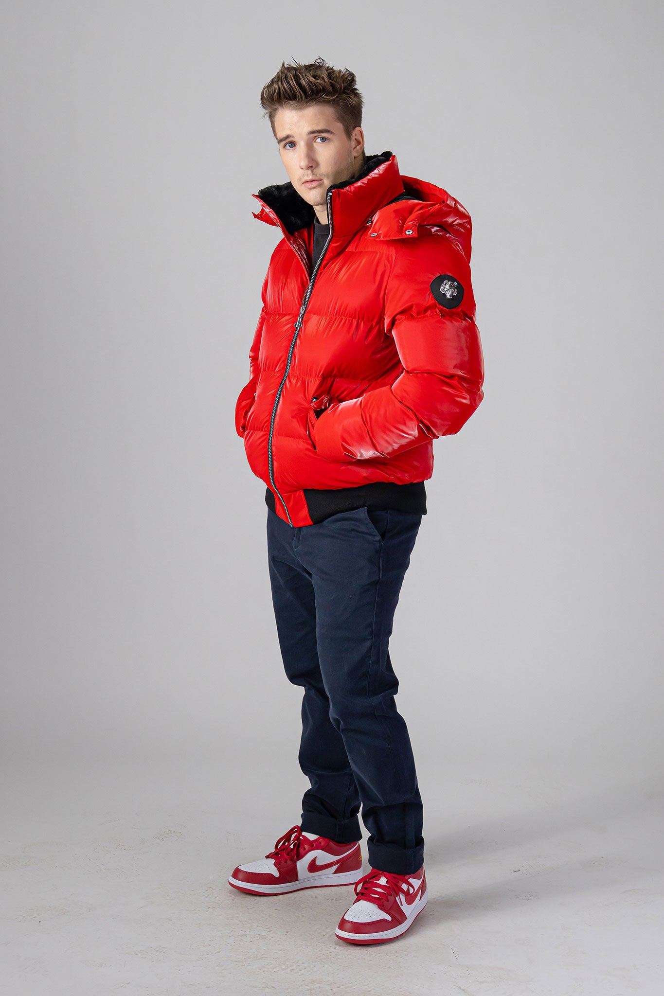 Woodpecker Men's Woody Bomber Winter coat. High-end Canadian designer winter coat for men in “Fashion Santa" colour. Woodpecker cruelty-free winter coat designed in Canada. Men's heavy weight short length premium designer jacket for winter. Superior quality warm winter coat for men. Moose Knuckles, Canada Goose, Mackage, Montcler, Will Poho, Willbird, Nic Bayley. Shiny parka. Stylish winter jacket. Designer winter coat.