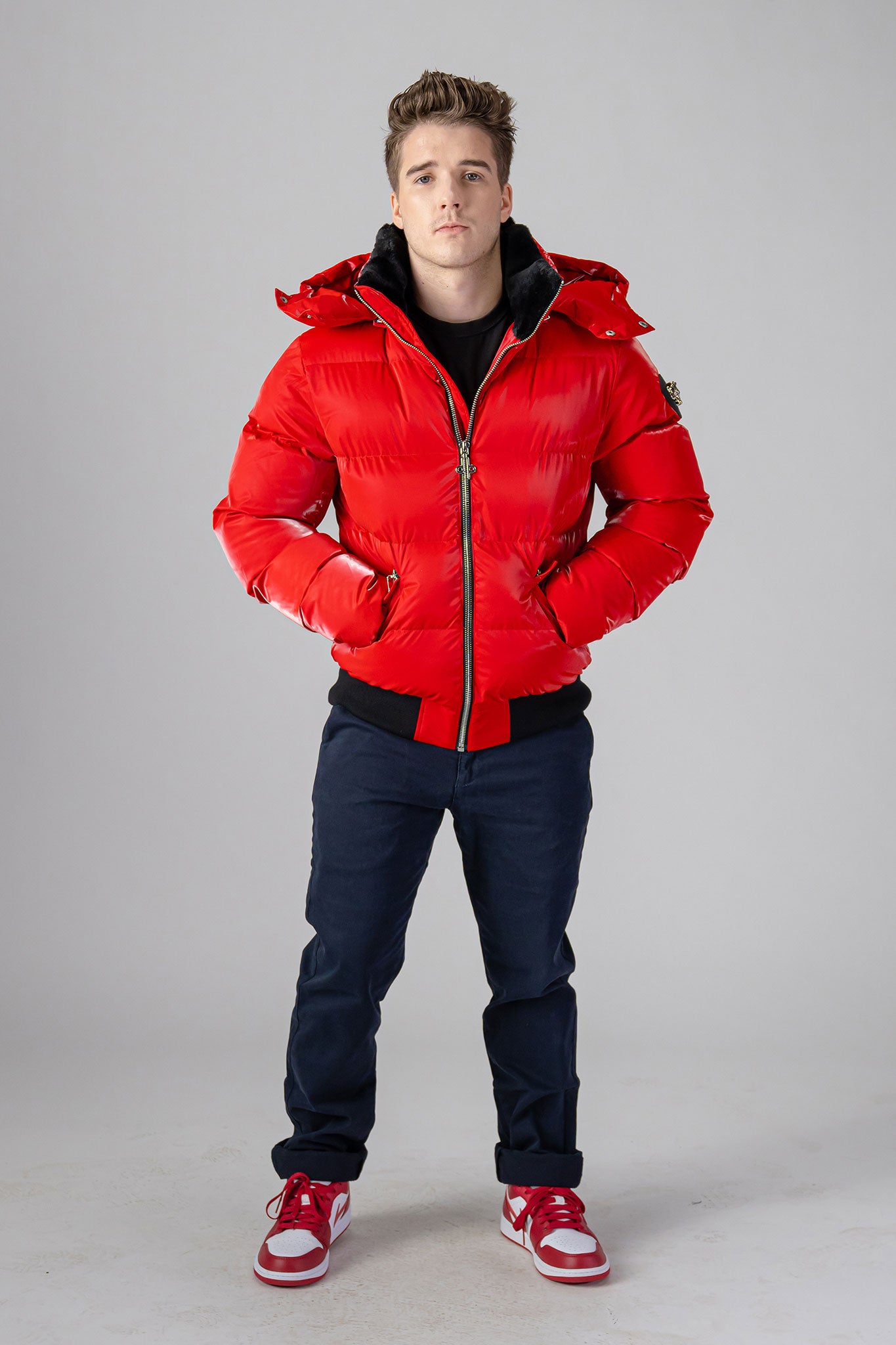 Woodpecker Men's Woody Bomber Winter coat. High-end Canadian designer winter coat for men in “Fashion Santa" colour. Woodpecker cruelty-free winter coat designed in Canada. Men's heavy weight short length premium designer jacket for winter. Superior quality warm winter coat for men. Moose Knuckles, Canada Goose, Mackage, Montcler, Will Poho, Willbird, Nic Bayley. Shiny parka. Stylish winter jacket. Designer winter coat.