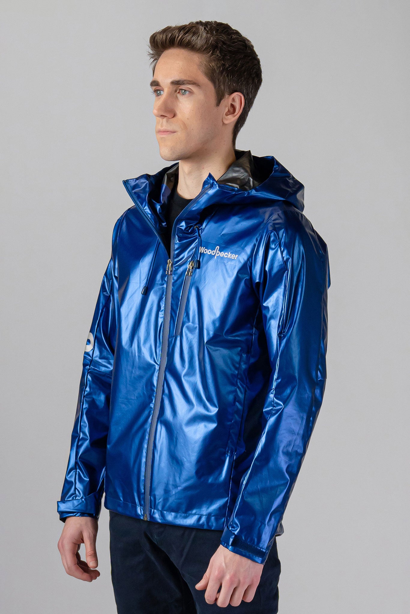 Woodpecker Men's Wind Shell coat. High-end Canadian designer activewear coat for men in "Flash Blue" colour. Woodpecker coat designed in Canada. Moose Knuckles, Canada Goose, Mackage, Montcler, Will Poho, Willbird, Nic Bayley