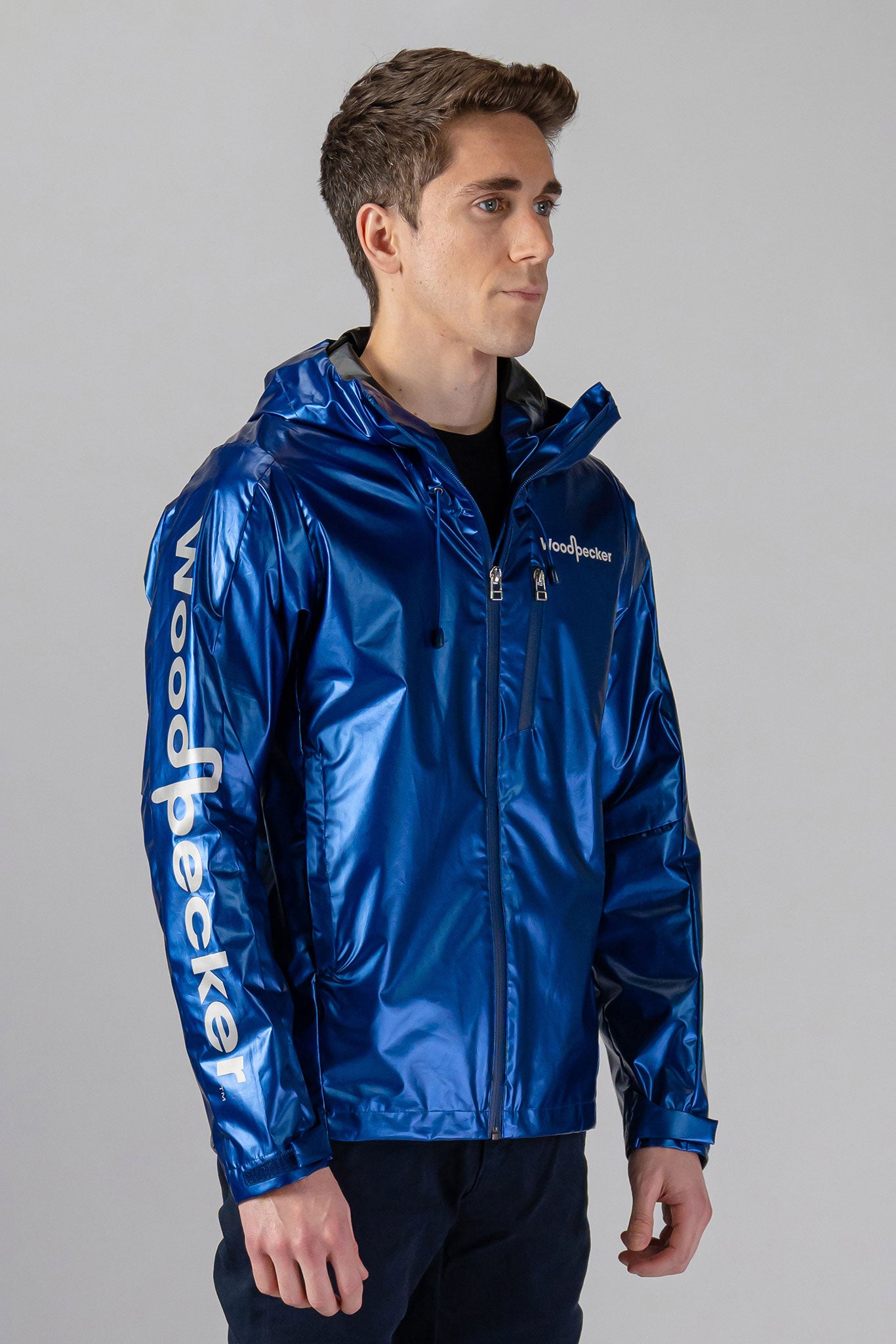 Woodpecker Men's Wind Shell coat. High-end Canadian designer activewear coat for men in "Flash Blue" colour. Woodpecker coat designed in Canada. Moose Knuckles, Canada Goose, Mackage, Montcler, Will Poho, Willbird, Nic Bayley