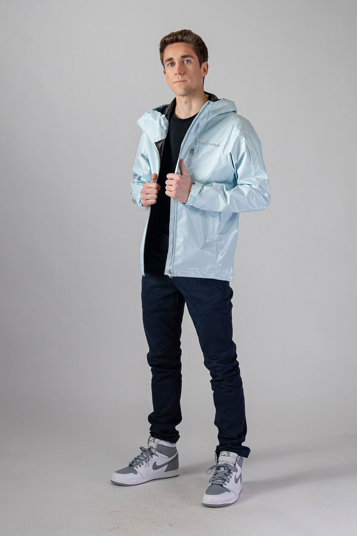 Woodpecker Men's Wind Shell coat. High-end Canadian designer activewear coat for men in "Pastel Blue" colour. Woodpecker coat designed in Canada. Moose Knuckles, Canada Goose, Mackage, Montcler, Will Poho, Willbird, Nic Bayley
