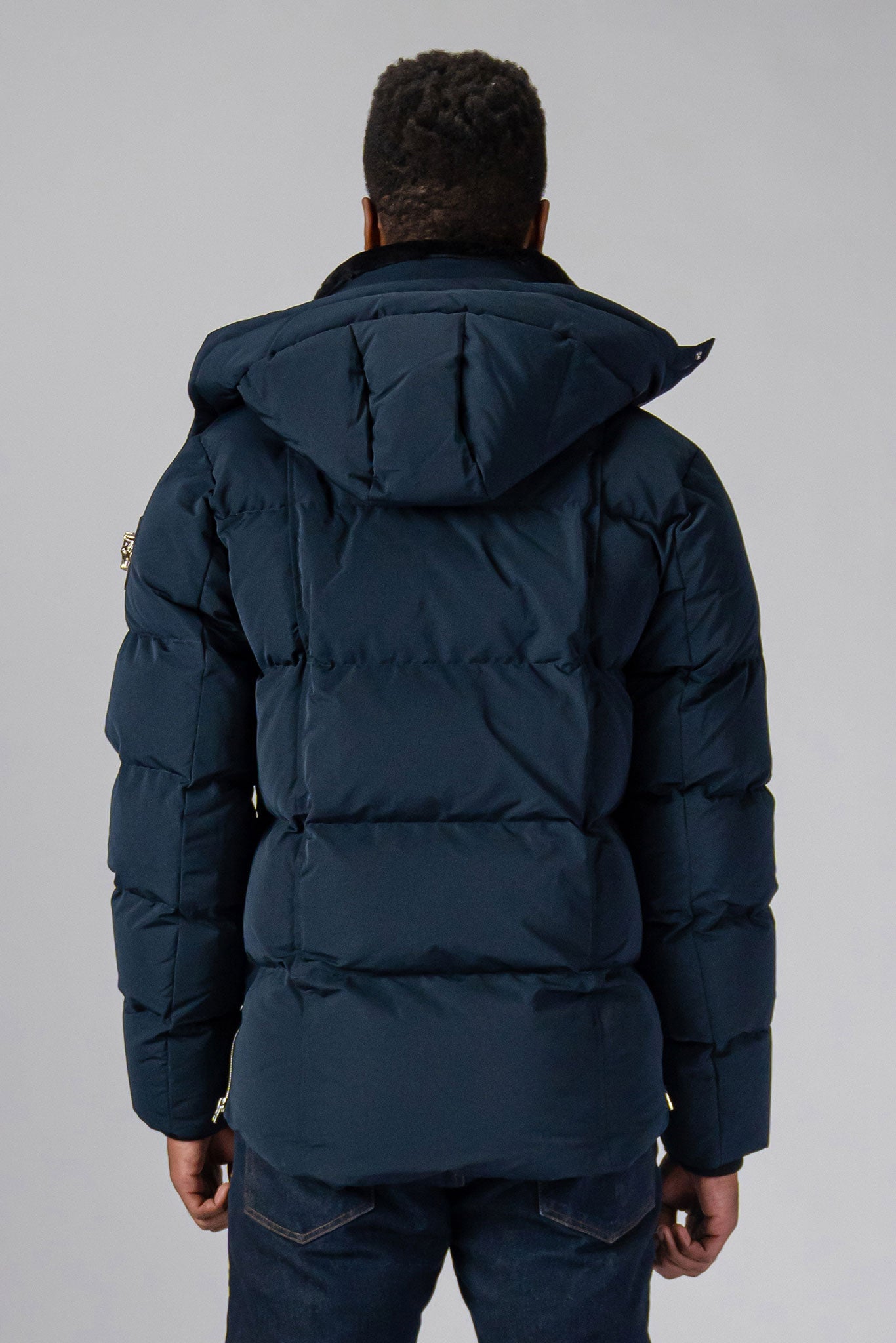 High-end Canadian designer winter coat for men in "Matte Navy" colour. Woodpecker cruelty-free winter coat designed in Canada. Men's heavy weight medium length premium designer jacket for winter. Superior quality warm winter coat for men. Moose Knuckles, Canada Goose, Mackage, Montcler, Will Poho, Willbird, Nic Bayley. Shiny parka. Stylish winter jacket. Designer winter coat.