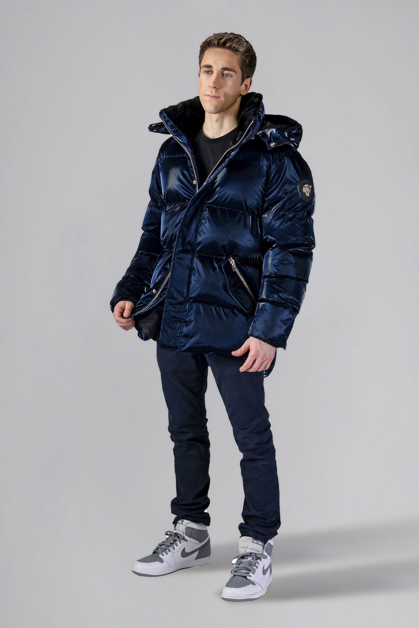 Woodpecker Men's Bumnester Winter coat. High-end Canadian designer winter coat for men in "All Wet Navy" colour. Woodpecker cruelty-free winter coat designed in Canada. Men's heavy weight medium length premium designer jacket for winter. Superior quality warm winter coat for men. Moose Knuckles, Canada Goose, Mackage, Montcler, Will Poho, Willbird, Nic Bayley. Shiny parka. Stylish winter jacket. Designer winter coat.