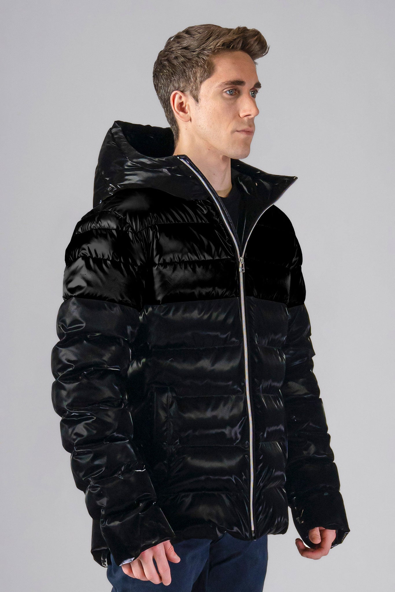 Woodpecker Men's Sparrow Winter coat. High-end Canadian designer winter coat for men in "All Wet Black" colour. Woodpecker cruelty-free winter coat designed in Canada. Men's medium weight medium length premium designer jacket for winter. Superior quality warm winter coat for men. Moose Knuckles, Canada Goose, Mackage, Montcler, Will Poho, Willbird, Nic Bayley. Shiny parka. Stylish winter jacket. Designer winter coat.