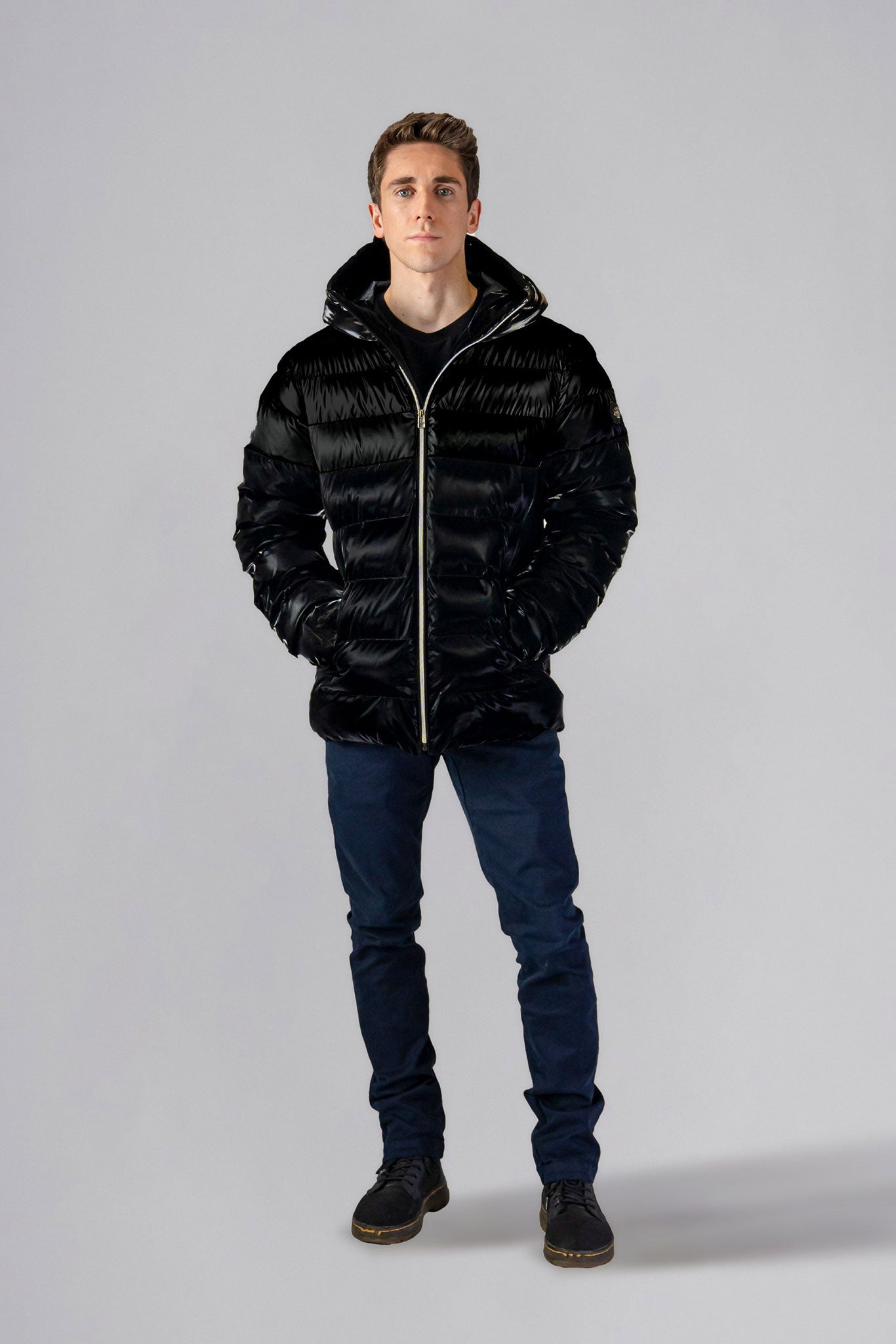 Woodpecker Men's Sparrow Winter coat. High-end Canadian designer winter coat for men in "All Wet Black" colour. Woodpecker cruelty-free winter coat designed in Canada. Men's medium weight medium length premium designer jacket for winter. Superior quality warm winter coat for men. Moose Knuckles, Canada Goose, Mackage, Montcler, Will Poho, Willbird, Nic Bayley. Shiny parka. Stylish winter jacket. Designer winter coat.