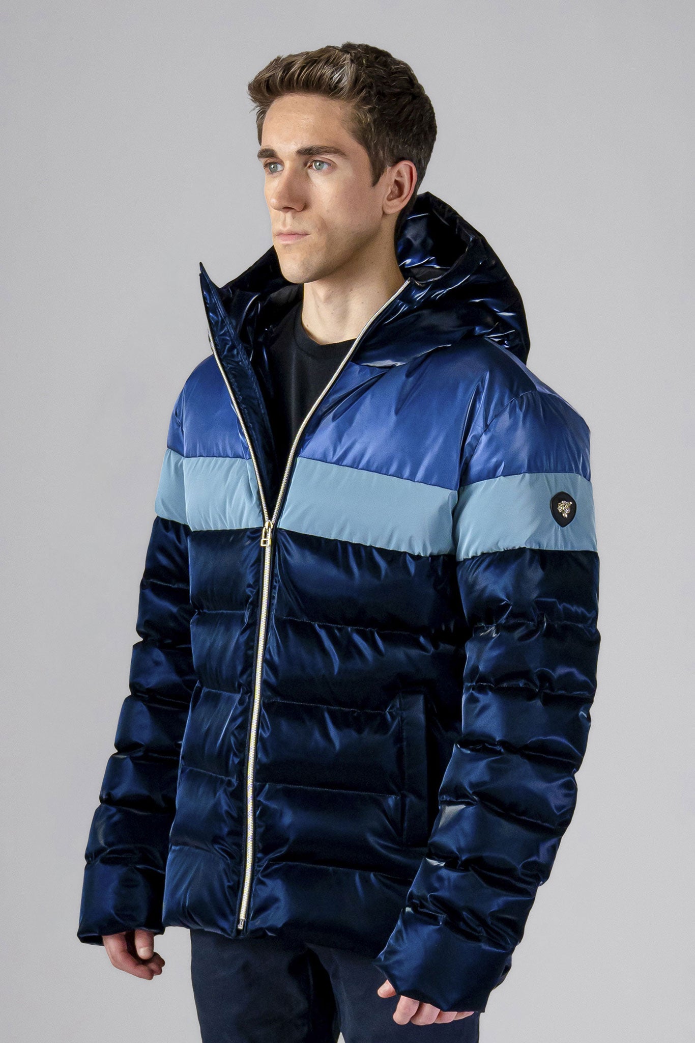 Woodpecker Men's Sparrow Winter coat. High-end Canadian designer winter coat for men in "Blue Steel" colour. Woodpecker cruelty-free winter coat designed in Canada. Men's medium weight medium length premium designer jacket for winter. Superior quality warm winter coat for men. Moose Knuckles, Canada Goose, Mackage, Montcler, Will Poho, Willbird, Nic Bayley. Shiny parka. Stylish winter jacket. Designer winter coat.