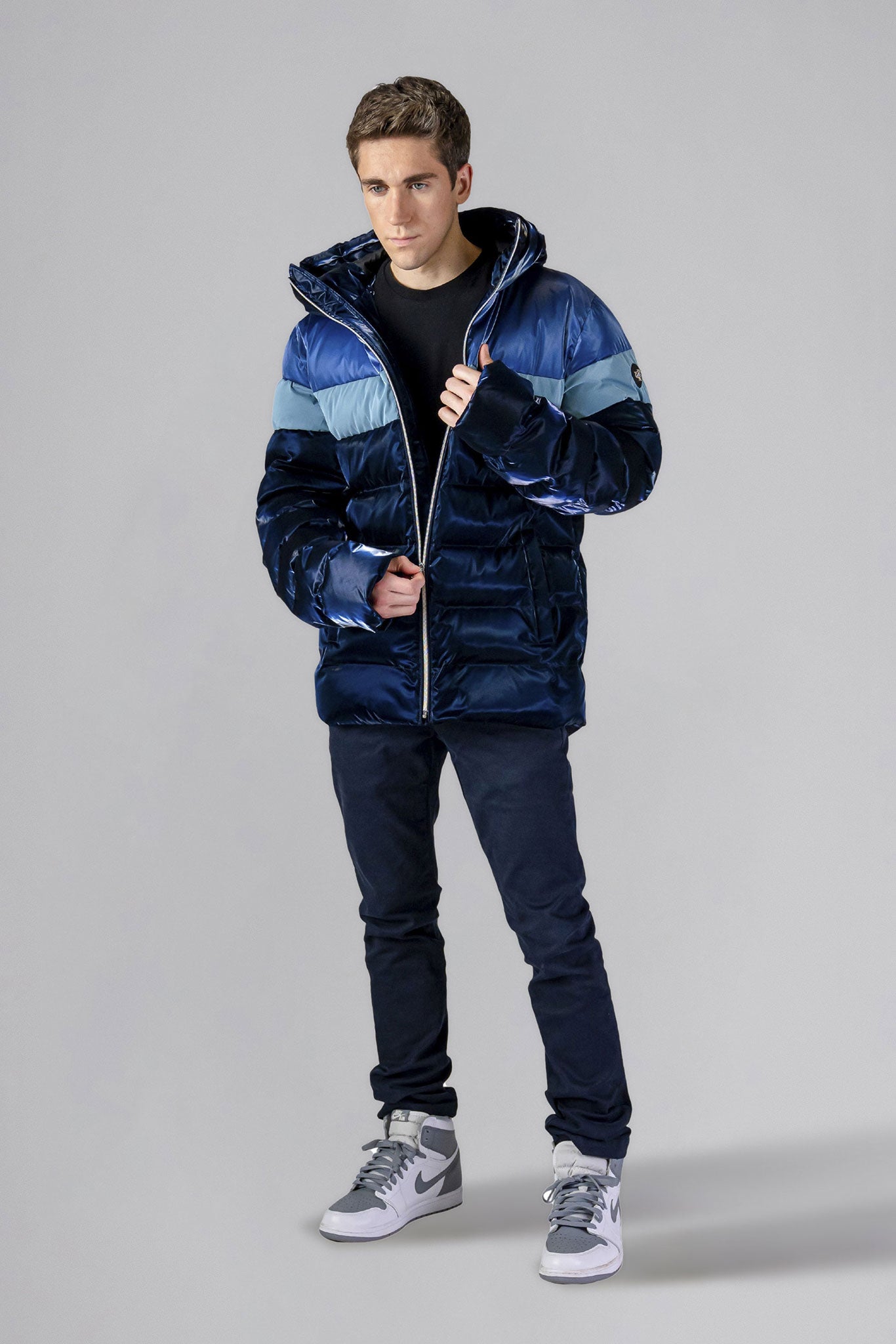 Woodpecker Men's Sparrow Winter coat. High-end Canadian designer winter coat for men in "Blue Steel" colour. Woodpecker cruelty-free winter coat designed in Canada. Men's medium weight medium length premium designer jacket for winter. Superior quality warm winter coat for men. Moose Knuckles, Canada Goose, Mackage, Montcler, Will Poho, Willbird, Nic Bayley. Shiny parka. Stylish winter jacket. Designer winter coat.