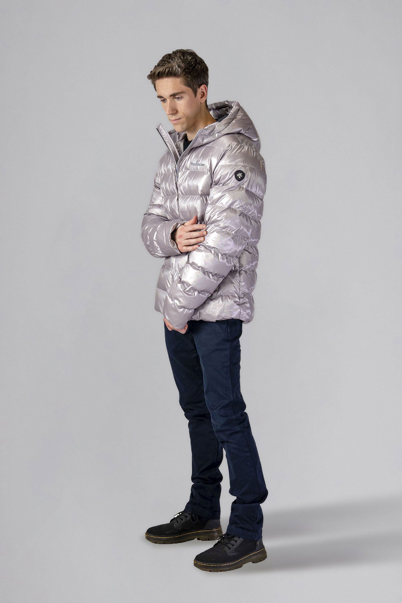 High-end Canadian designer winter coat for men in "Pearl Grey" colour. Woodpecker cruelty-free winter coat designed in Canada. Men's medium weight medium length premium designer jacket for winter. Superior quality warm winter coat for men. Moose Knuckles, Canada Goose, Mackage, Montcler, Will Poho, Willbird, Nic Bayley. Shiny parka. Stylish winter jacket. Designer winter coat.