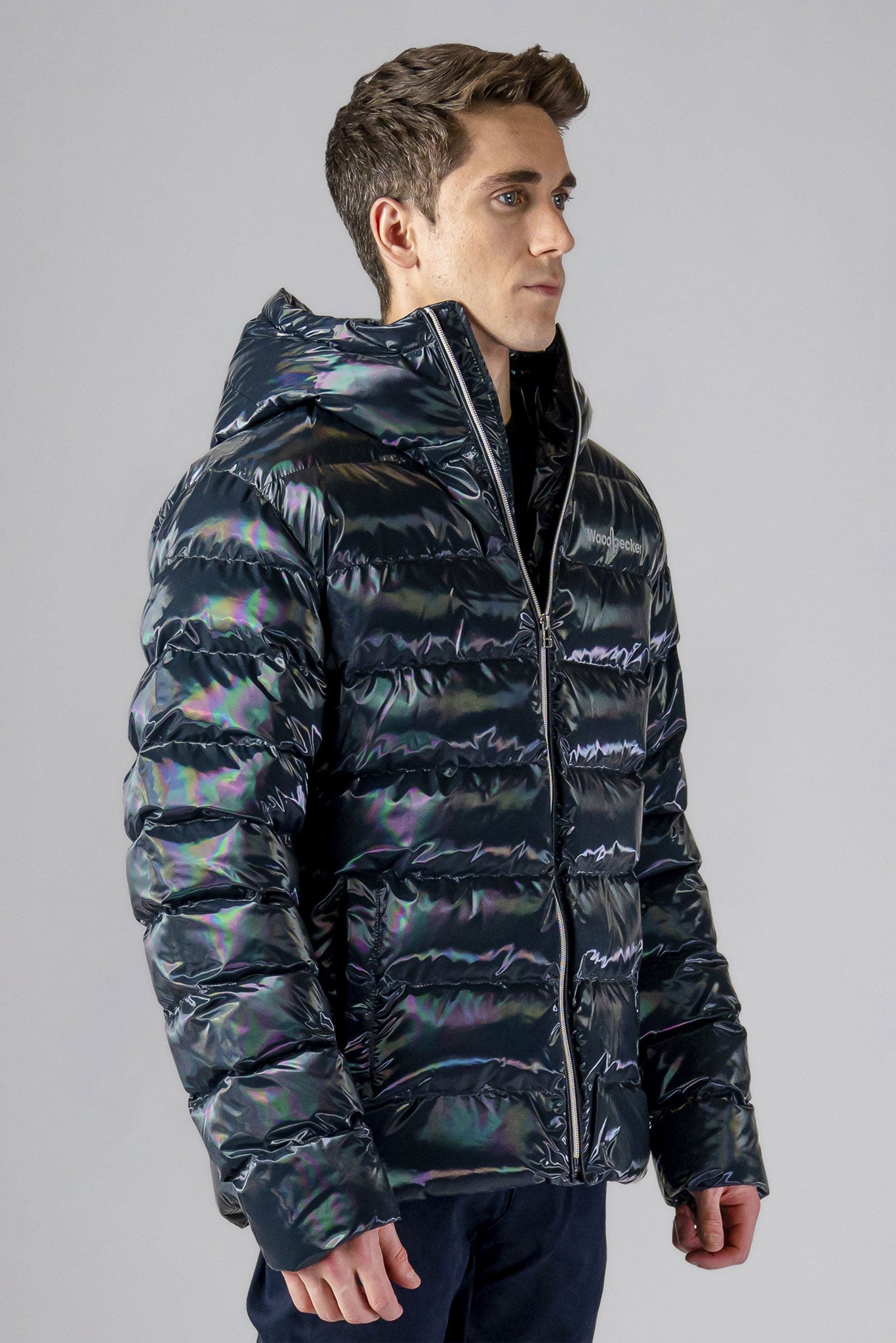 High-end Canadian designer winter coat for men in "Raven Black" colour. Woodpecker cruelty-free winter coat designed in Canada. Men's medium weight medium length premium designer jacket for winter. Superior quality warm winter coat for men. Moose Knuckles, Canada Goose, Mackage, Montcler, Will Poho, Willbird, Nic Bayley. Shiny parka. Stylish winter jacket. Designer winter coat.