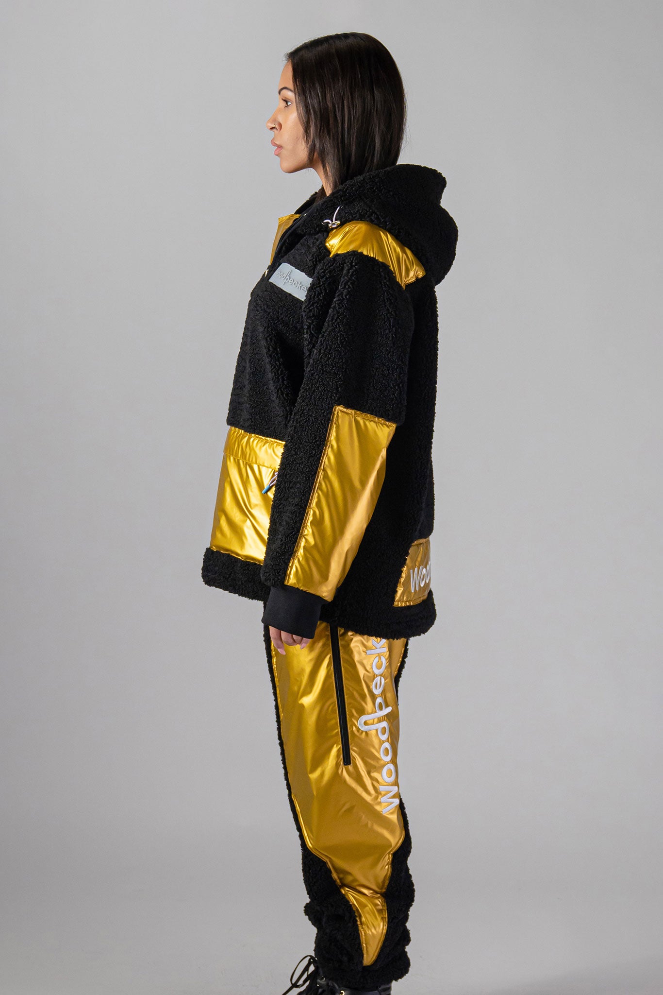 Woodpecker Unisex Fleece Track Pants. High-end Canadian designer winter fleece in "Gold" colour. Woodpecker fleece pants designed in Canada. Warm premium designer fleece pants for winter. Superior quality warm fleece track pants. Moose Knuckles, Canada Goose, Mackage, Montcler, Will Poho, Willbird, Nic Bayley. Cozy for at-home wear.