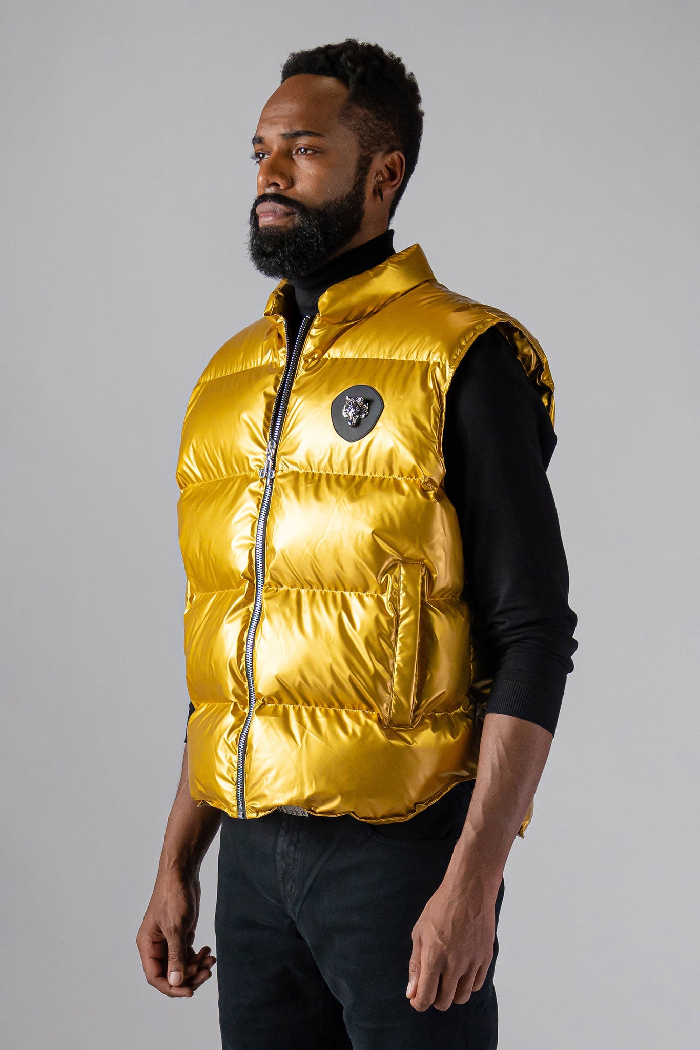 Woodpecker Unisex Winter Vest. High-end Canadian designer winter vest in "Gold" colour. Woodpecker cruelty-free vest designed in Canada. Heavy weight short length premium designer vest for winter. Superior quality warm winter vest. Moose Knuckles, Canada Goose, Mackage, Montcler, Will Poho, Willbird, Nic Bayley. Extra warm. Shiny vest. Stylish winter vest. Designer winter vest.