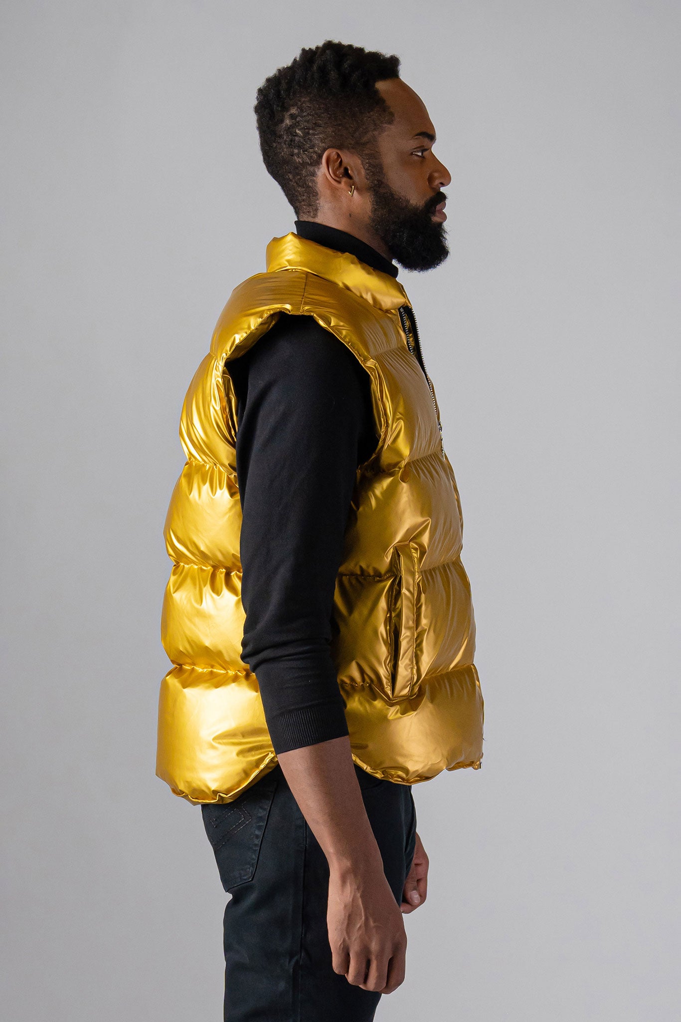 Woodpecker Unisex Winter Vest. High-end Canadian designer winter vest in "Gold" colour. Woodpecker cruelty-free vest designed in Canada. Heavy weight short length premium designer vest for winter. Superior quality warm winter vest. Moose Knuckles, Canada Goose, Mackage, Montcler, Will Poho, Willbird, Nic Bayley. Extra warm. Shiny vest. Stylish winter vest. Designer winter vest.