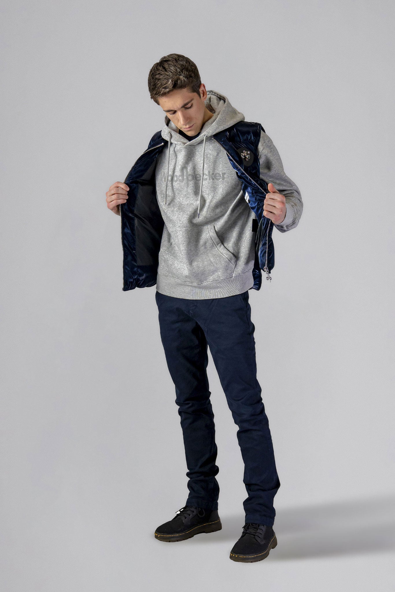 Woodpecker Unisex Winter Vest. High-end Canadian designer winter vest in "All Wet Navy" colour. Woodpecker cruelty-free vest designed in Canada. Heavy weight short length premium designer vest for winter. Superior quality warm winter vest. Moose Knuckles, Canada Goose, Mackage, Montcler, Will Poho, Willbird, Nic Bayley. Extra warm. Shiny vest. Stylish winter vest. Designer winter vest.