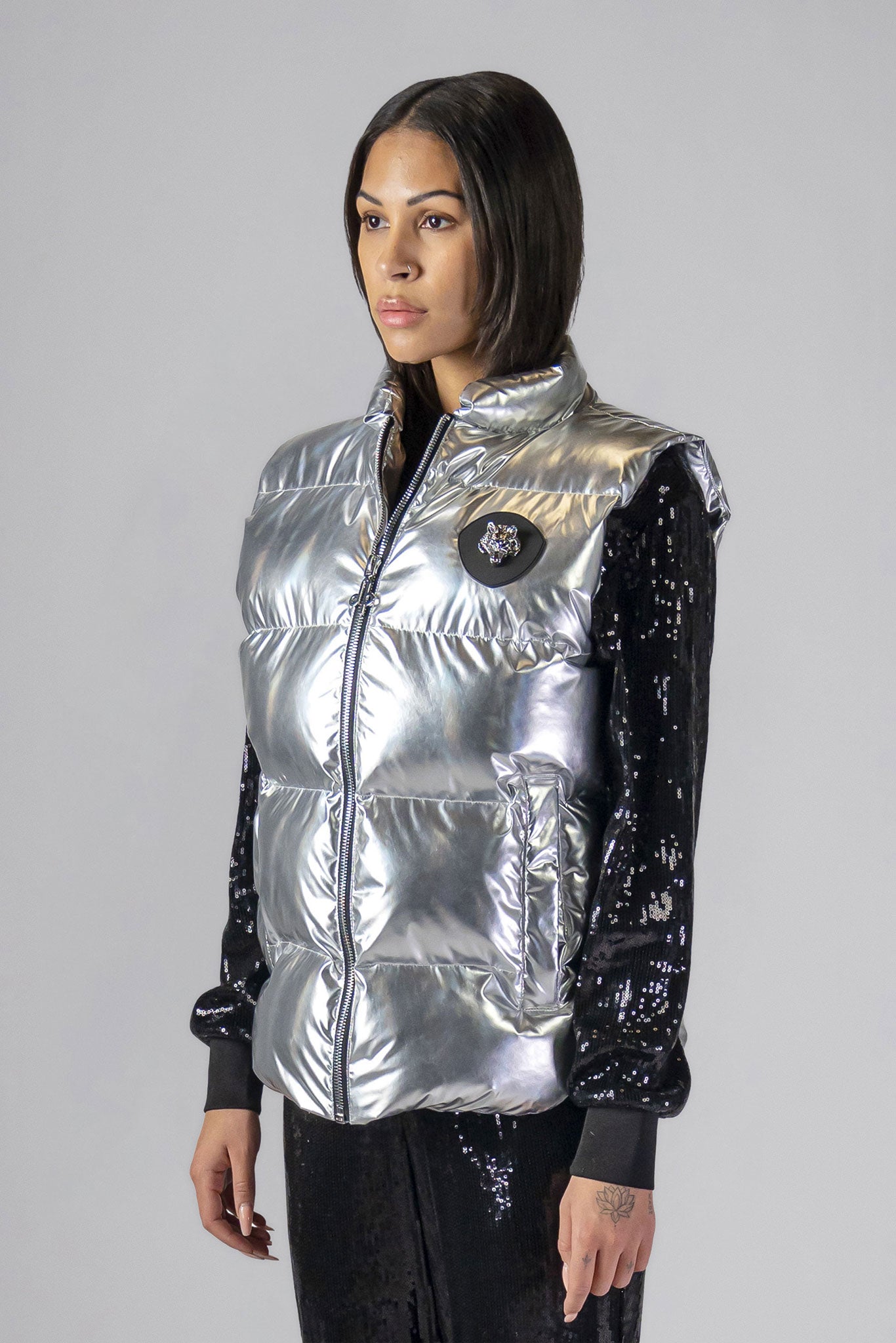 Woodpecker Unisex Winter Vest. High-end Canadian designer winter vest in "Silver" colour. Woodpecker cruelty-free vest designed in Canada. Heavy weight short length premium designer vest for winter. Superior quality warm winter vest. Moose Knuckles, Canada Goose, Mackage, Montcler, Will Poho, Willbird, Nic Bayley. Extra warm. Shiny vest. Stylish winter vest. Designer winter vest.