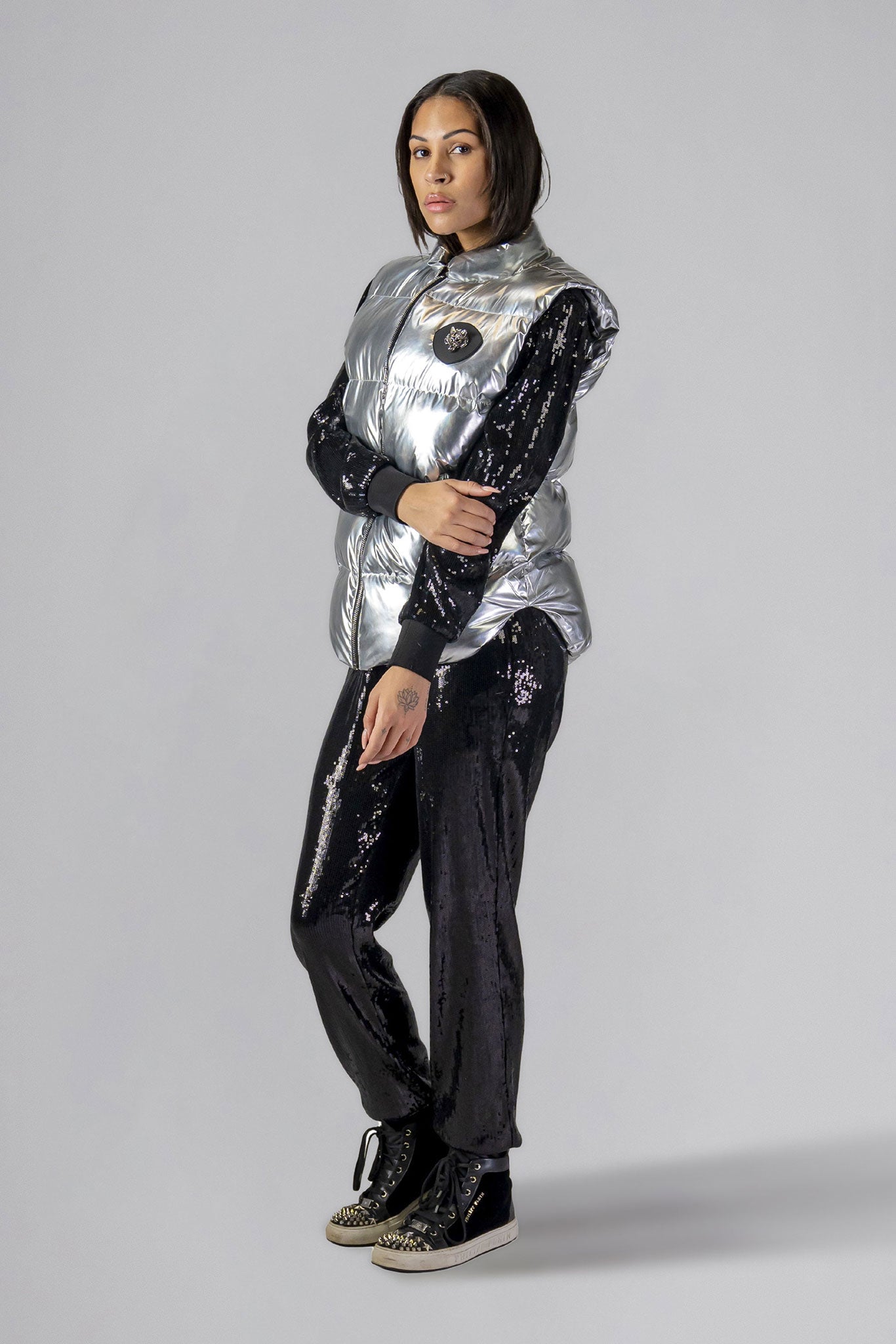 Woodpecker Unisex Winter Vest. High-end Canadian designer winter vest in "Silver" colour. Woodpecker cruelty-free vest designed in Canada. Heavy weight short length premium designer vest for winter. Superior quality warm winter vest. Moose Knuckles, Canada Goose, Mackage, Montcler, Will Poho, Willbird, Nic Bayley. Extra warm. Shiny vest. Stylish winter vest. Designer winter vest.