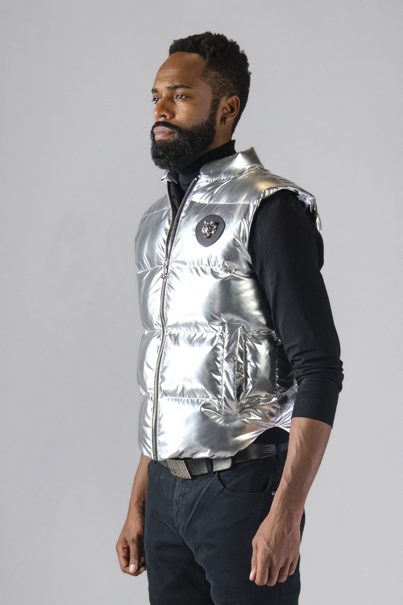 Woodpecker Unisex Winter Vest. High-end Canadian designer winter vest in "Silver" colour. Woodpecker cruelty-free vest designed in Canada. Heavy weight short length premium designer vest for winter. Superior quality warm winter vest. Moose Knuckles, Canada Goose, Mackage, Montcler, Will Poho, Willbird, Nic Bayley. Extra warm. Shiny vest. Stylish winter vest. Designer winter vest.