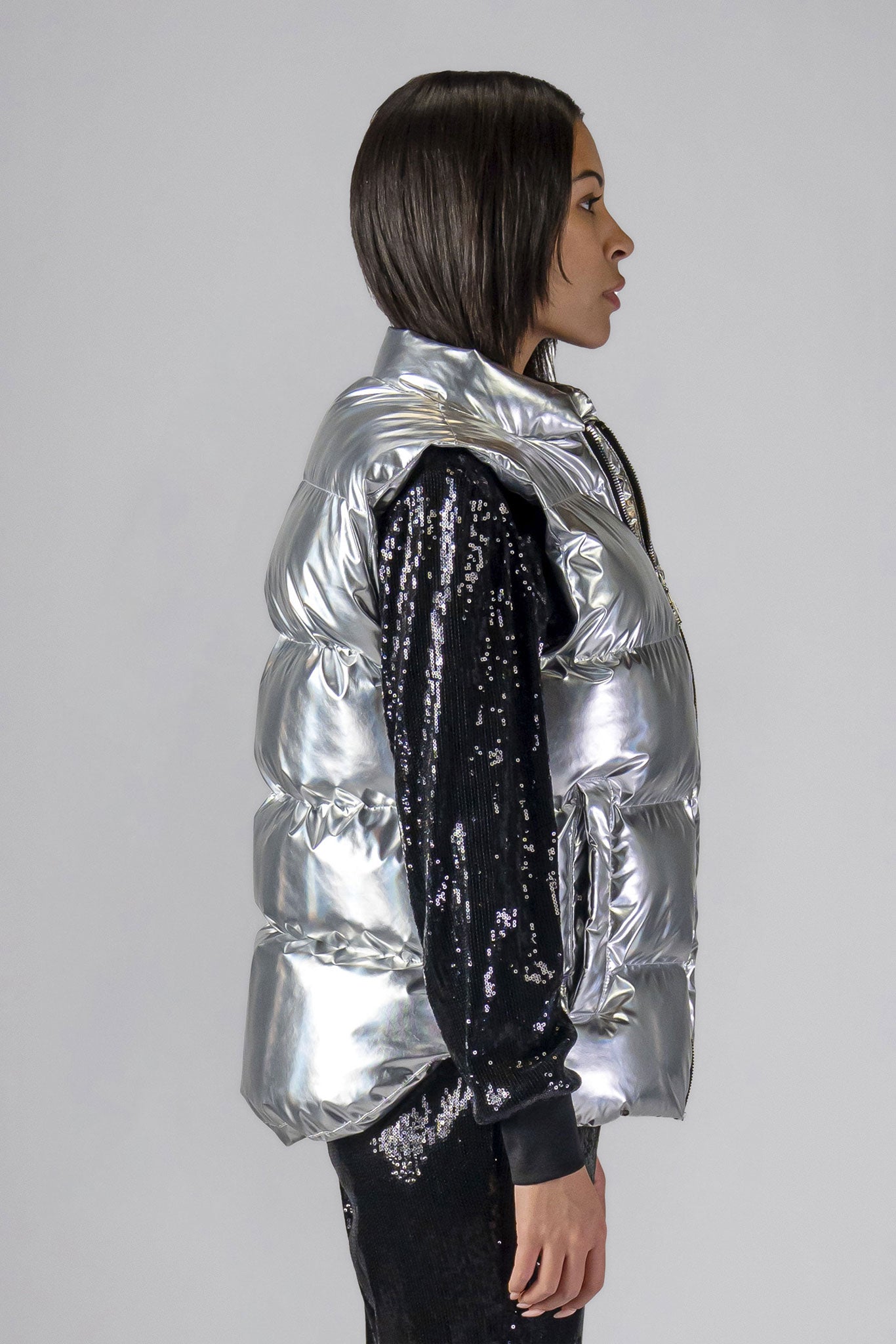 Woodpecker Unisex Winter Vest. High-end Canadian designer winter vest in "Silver" colour. Woodpecker cruelty-free vest designed in Canada. Heavy weight short length premium designer vest for winter. Superior quality warm winter vest. Moose Knuckles, Canada Goose, Mackage, Montcler, Will Poho, Willbird, Nic Bayley. Extra warm. Shiny vest. Stylish winter vest. Designer winter vest.