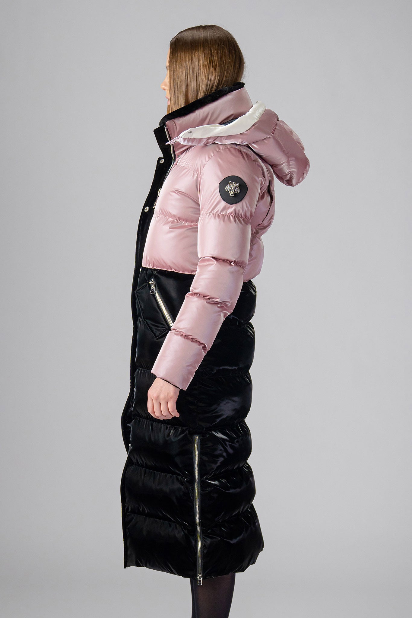 Woodpecker Women's Extra Long Bird of Paradise Winter coat. High-end Canadian designer winter coat for women in “Arctic Rose and Black" colour. Woodpecker cruelty-free winter coat designed in Canada. Women's heavy weight extra long length premium designer jacket for winter. Superior quality warm winter coat for women. Moose Knuckles, Canada Goose, Mackage, Montcler, Will Poho, Willbird, Nic Bayley. Extra warm. Shiny parka. Stylish winter jacket. Designer winter coat.