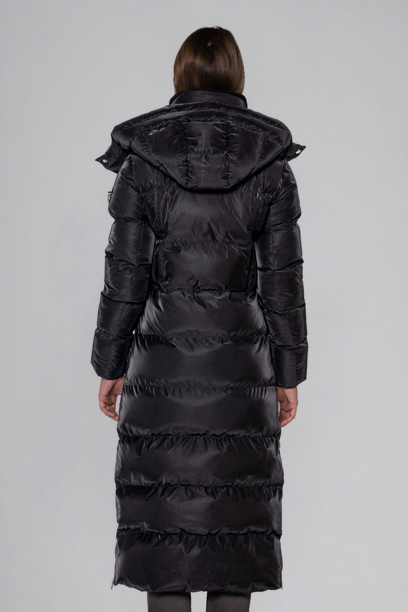 Woodpecker Women's Extra Long Bird of Paradise Winter coat. High-end Canadian designer winter coat for women in “Black Diamond" colour. Woodpecker cruelty-free winter coat designed in Canada. Women's heavy weight extra long length premium designer jacket for winter. Superior quality warm winter coat for women. Moose Knuckles, Canada Goose, Mackage, Montcler, Will Poho, Willbird, Nic Bayley. Extra warm. Shiny parka. Stylish winter jacket. Designer winter coat.