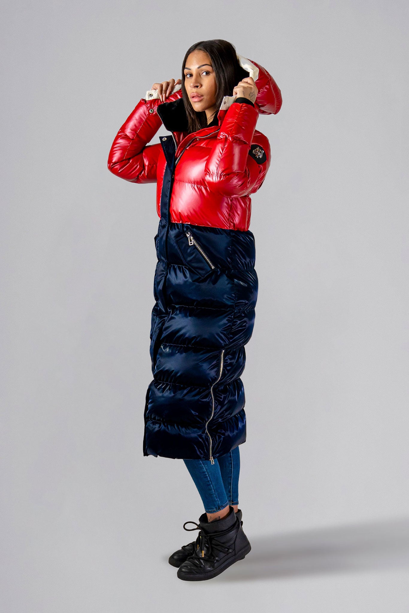 Woodpecker Women's Extra Long Bird of Paradise Winter coat. High-end Canadian designer winter coat for women in “Red White and Blue" colour. Woodpecker cruelty-free winter coat designed in Canada. Women's heavy weight extra long length premium designer jacket for winter. Superior quality warm winter coat for women. Moose Knuckles, Canada Goose, Mackage, Montcler, Will Poho, Willbird, Nic Bayley. Extra warm. Shiny parka. Stylish winter jacket. Designer winter coat.