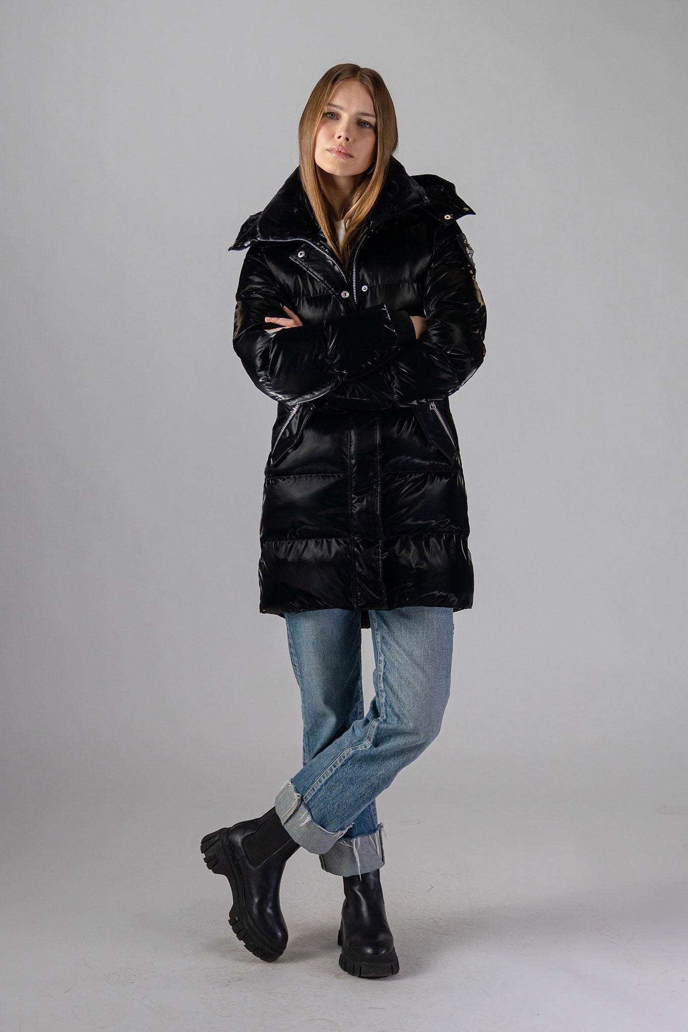 Woodpecker Women's Penguin Long Winter coat. High-end Canadian designer winter coat for women in "All Wet Black" colour. Woodpecker cruelty-free winter coat designed in Canada. Women's heavy weight long length premium designer jacket for winter. Superior quality warm winter coat for women. Moose Knuckles, Canada Goose, Mackage, Montcler, Will Poho, Willbird, Nic Bayley. Extra warm. Shiny parka. Stylish winter jacket. Designer winter coat.