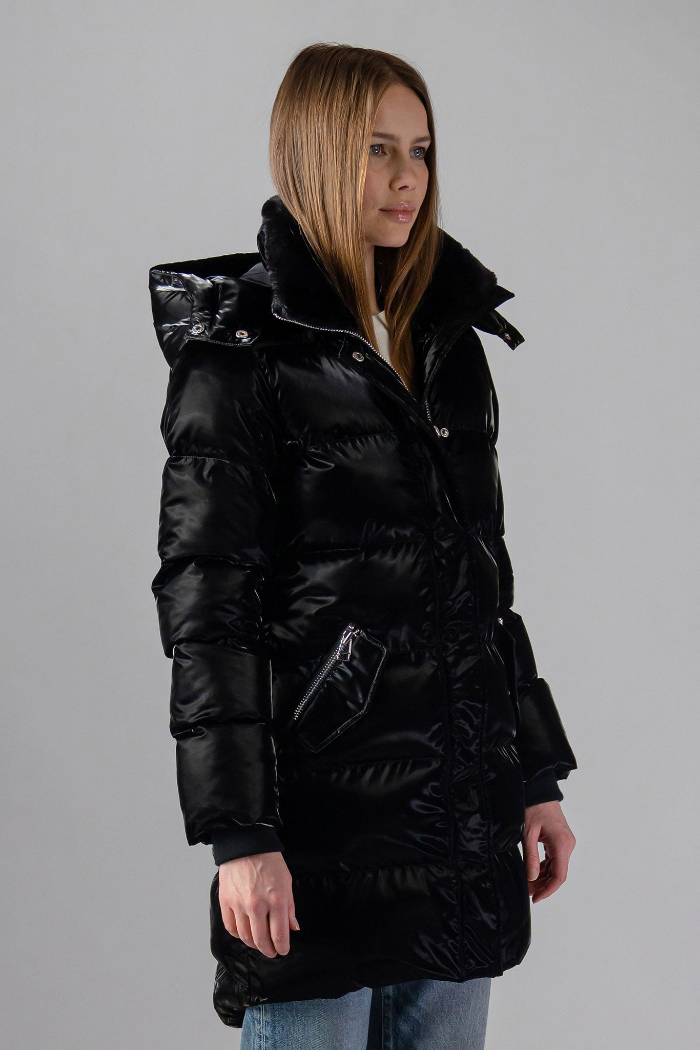 Woodpecker Women's Penguin Long Winter coat. High-end Canadian designer winter coat for women in "All Wet Black" colour. Woodpecker cruelty-free winter coat designed in Canada. Women's heavy weight long length premium designer jacket for winter. Superior quality warm winter coat for women. Moose Knuckles, Canada Goose, Mackage, Montcler, Will Poho, Willbird, Nic Bayley. Extra warm. Shiny parka. Stylish winter jacket. Designer winter coat.