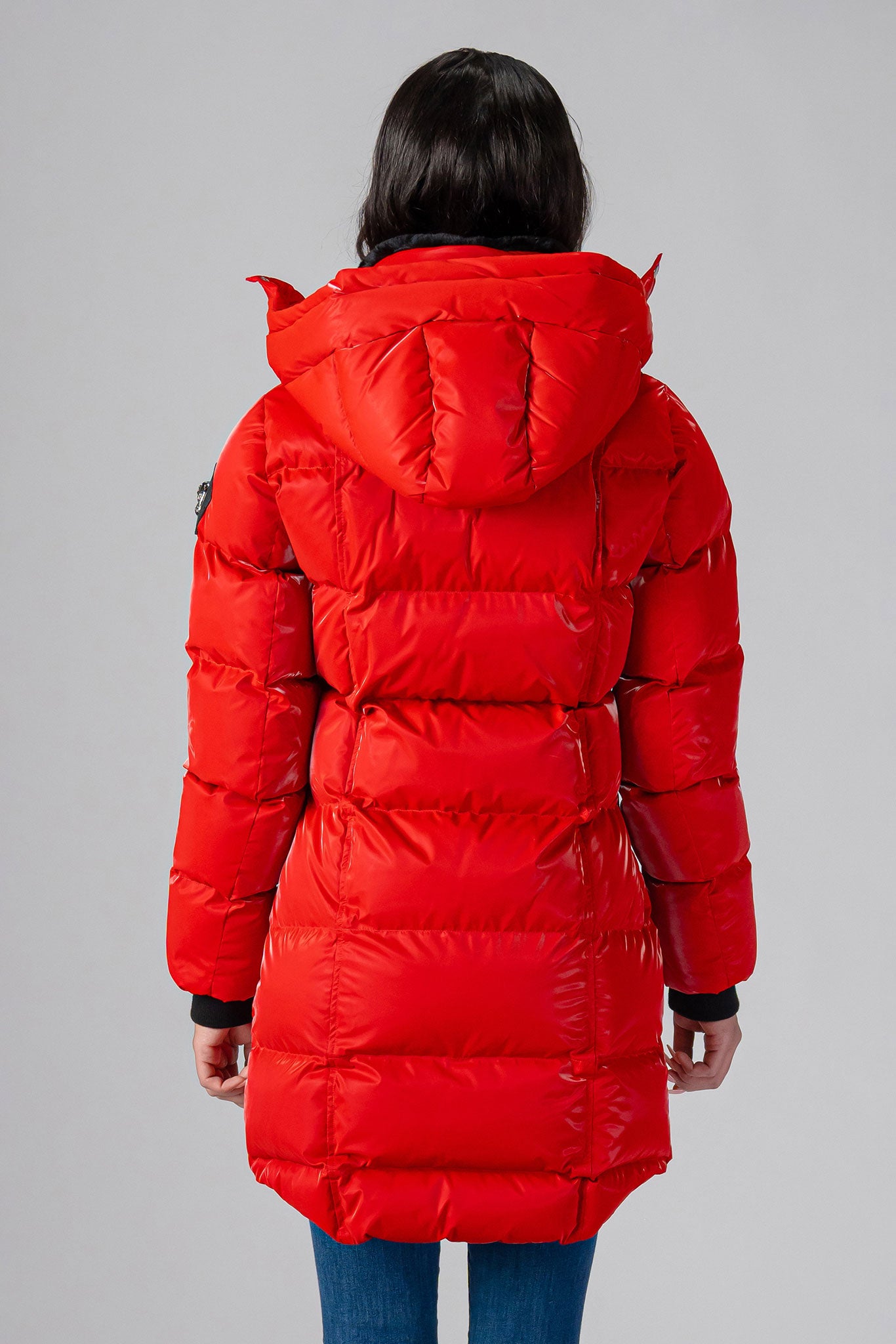 Woodpecker Women's Penguin Long Winter coat. High-end Canadian designer winter coat for women in "All Wet Red" colour. Woodpecker cruelty-free winter coat designed in Canada. Women's heavy weight long length premium designer jacket for winter. Superior quality warm winter coat for women. Moose Knuckles, Canada Goose, Mackage, Montcler, Will Poho, Willbird, Nic Bayley. Extra warm. Shiny parka. Stylish winter jacket. Designer winter coat.