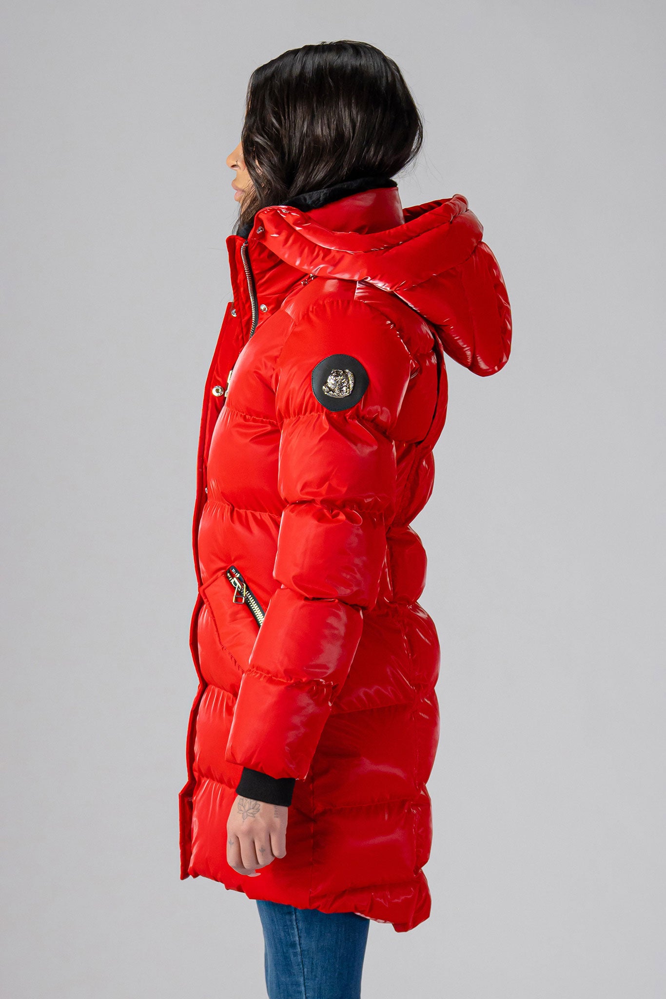 Woodpecker Women's Penguin Long Winter coat. High-end Canadian designer winter coat for women in "All Wet Red" colour. Woodpecker cruelty-free winter coat designed in Canada. Women's heavy weight long length premium designer jacket for winter. Superior quality warm winter coat for women. Moose Knuckles, Canada Goose, Mackage, Montcler, Will Poho, Willbird, Nic Bayley. Extra warm. Shiny parka. Stylish winter jacket. Designer winter coat.