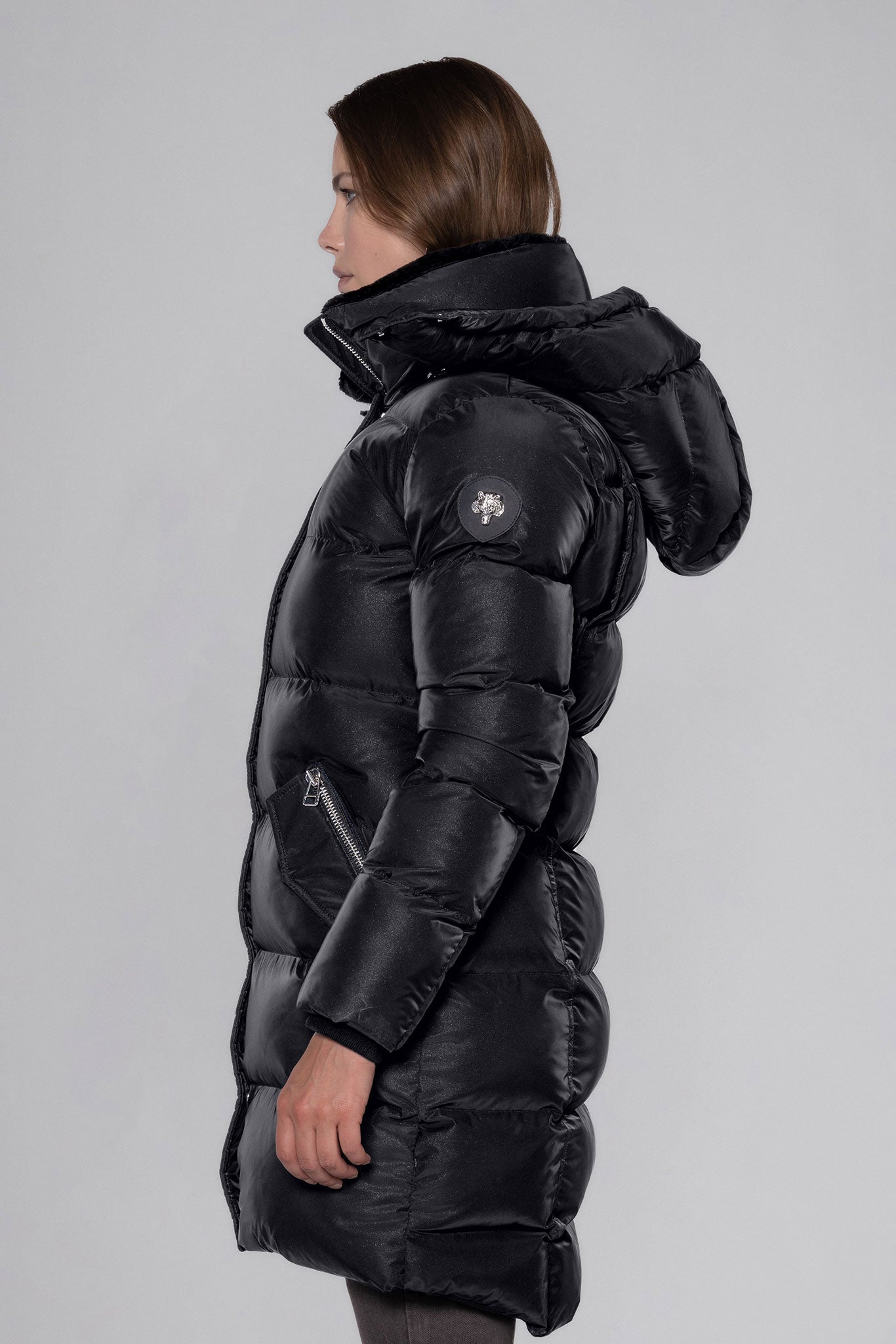 Woodpecker Women's Penguin Long Winter coat. High-end Canadian designer winter coat for women in "Black Diamond" colour. Woodpecker cruelty-free winter coat designed in Canada. Women's heavy weight long length premium designer jacket for winter. Superior quality warm winter coat for women. Moose Knuckles, Canada Goose, Mackage, Montcler, Will Poho, Willbird, Nic Bayley. Extra warm. Shiny parka. Stylish winter jacket. Designer winter coat.