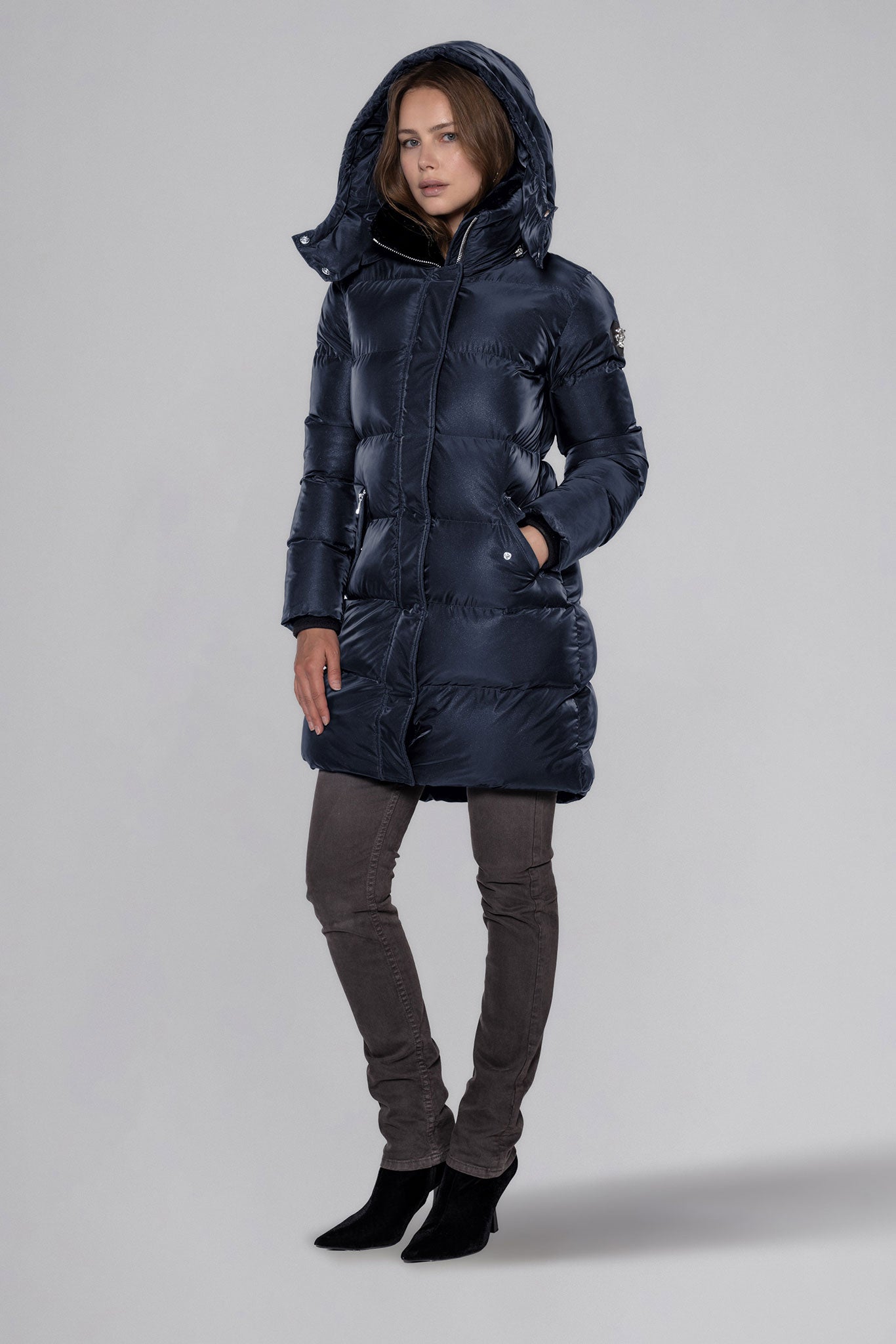 Woodpecker Women's Penguin Long Winter coat. High-end Canadian designer winter coat for women in "Blue Diamond" colour. Woodpecker cruelty-free winter coat designed in Canada. Women's heavy weight long length premium designer jacket for winter. Superior quality warm winter coat for women. Moose Knuckles, Canada Goose, Mackage, Montcler, Will Poho, Willbird, Nic Bayley. Extra warm. Shiny parka. Stylish winter jacket. Designer winter coat.