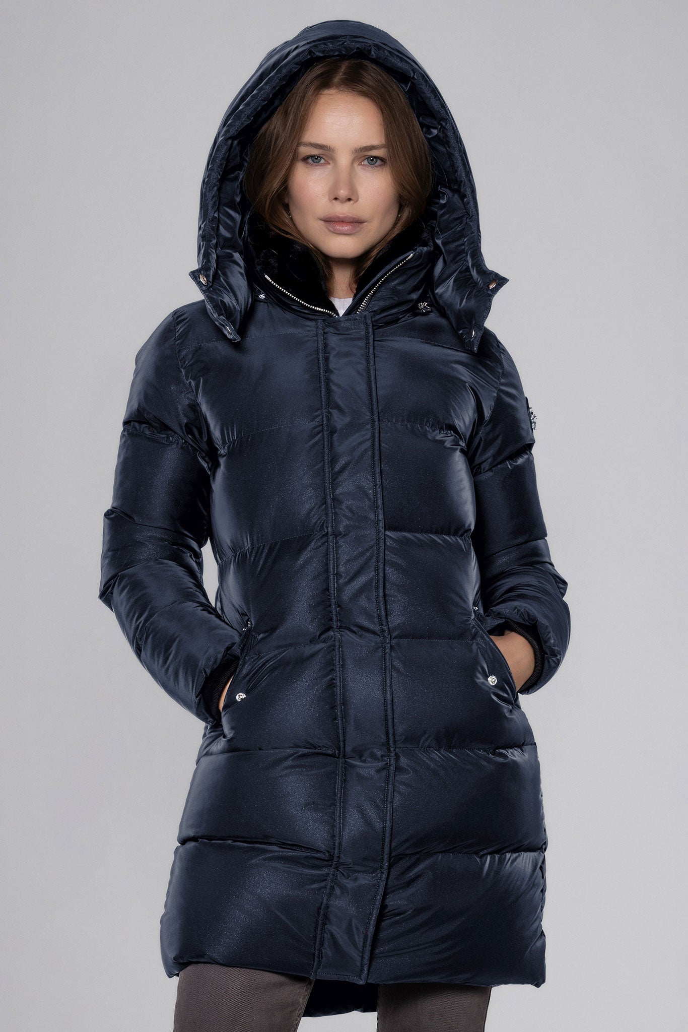Woodpecker Women's Penguin Long Winter coat. High-end Canadian designer winter coat for women in "Blue Diamond" colour. Woodpecker cruelty-free winter coat designed in Canada. Women's heavy weight long length premium designer jacket for winter. Superior quality warm winter coat for women. Moose Knuckles, Canada Goose, Mackage, Montcler, Will Poho, Willbird, Nic Bayley. Extra warm. Shiny parka. Stylish winter jacket. Designer winter coat.