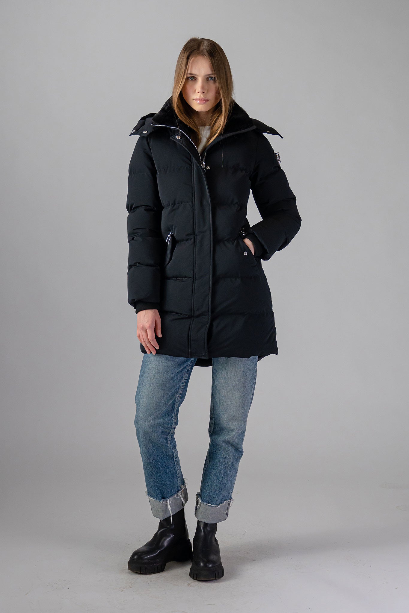 Woodpecker Women's Penguin Long Winter coat. High-end Canadian designer winter coat for women in "Matte Black" colour. Woodpecker cruelty-free winter coat designed in Canada. Women's heavy weight long length premium designer jacket for winter. Superior quality warm winter coat for women. Moose Knuckles, Canada Goose, Mackage, Montcler, Will Poho, Willbird, Nic Bayley. Extra warm. Shiny parka. Stylish winter jacket. Designer winter coat.