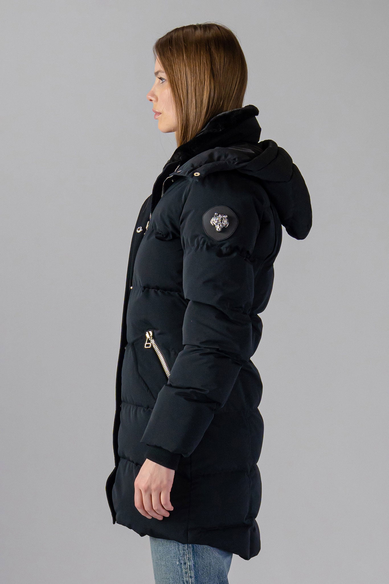 Woodpecker Women's Penguin Long Winter coat. High-end Canadian designer winter coat for women in "Matte Black" colour. Woodpecker cruelty-free winter coat designed in Canada. Women's heavy weight long length premium designer jacket for winter. Superior quality warm winter coat for women. Moose Knuckles, Canada Goose, Mackage, Montcler, Will Poho, Willbird, Nic Bayley. Extra warm. Shiny parka. Stylish winter jacket. Designer winter coat.