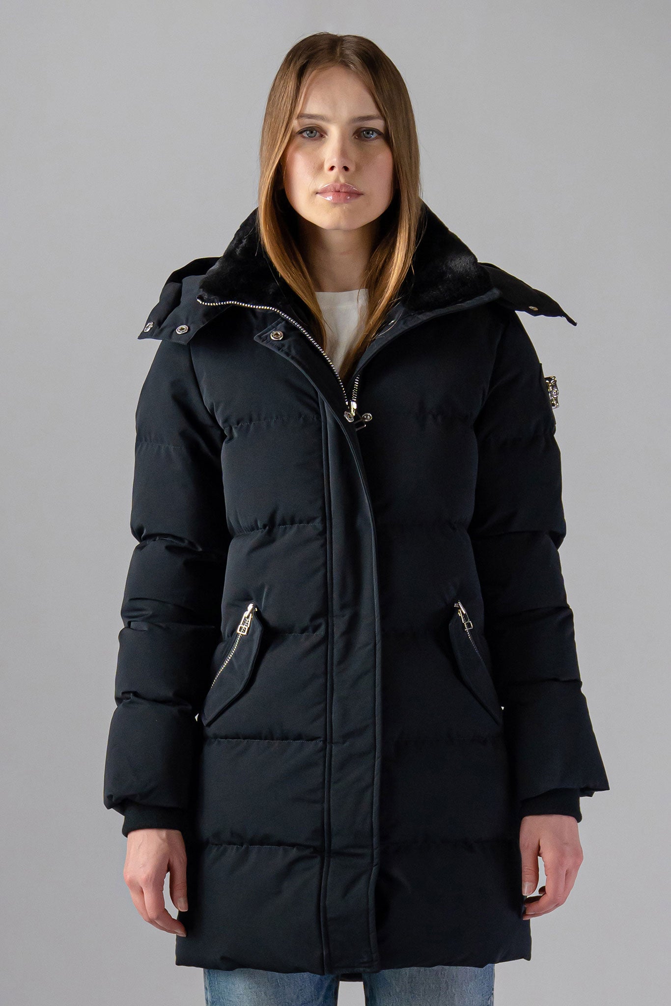 Woodpecker Women's Penguin Long Winter coat. High-end Canadian designer winter coat for women in "Matte Black" colour. Woodpecker cruelty-free winter coat designed in Canada. Women's heavy weight long length premium designer jacket for winter. Superior quality warm winter coat for women. Moose Knuckles, Canada Goose, Mackage, Montcler, Will Poho, Willbird, Nic Bayley. Extra warm. Shiny parka. Stylish winter jacket. Designer winter coat.