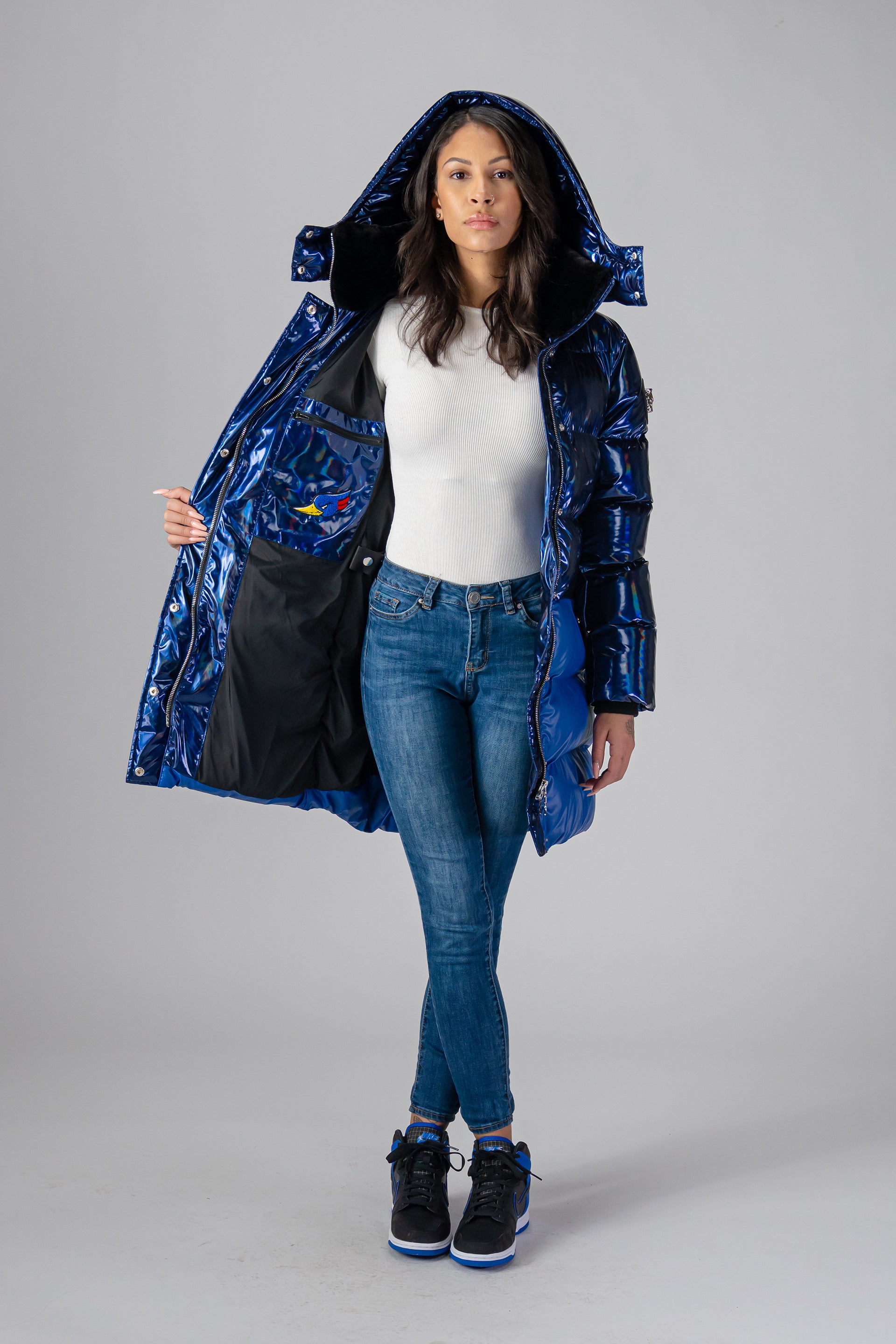 Woodpecker Women's Penguin Long Winter coat. High-end Canadian designer winter coat for women in "Oily Blue and Blue" colour. Woodpecker cruelty-free winter coat designed in Canada. Women's heavy weight long length premium designer jacket for winter. Superior quality warm winter coat for women. Moose Knuckles, Canada Goose, Mackage, Montcler, Will Poho, Willbird, Nic Bayley