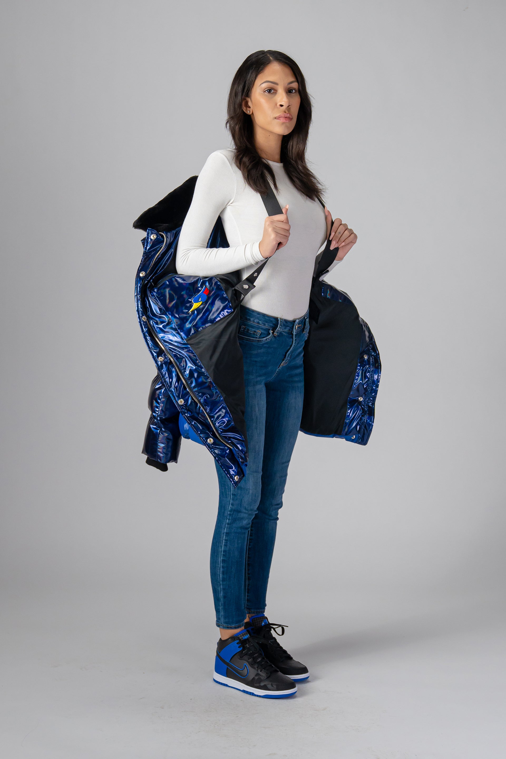 Woodpecker Women's Penguin Long Winter coat. High-end Canadian designer winter coat for women in "Oily Blue and Blue" colour. Woodpecker cruelty-free winter coat designed in Canada. Women's heavy weight long length premium designer jacket for winter. Superior quality warm winter coat for women. Moose Knuckles, Canada Goose, Mackage, Montcler, Will Poho, Willbird, Nic Bayley