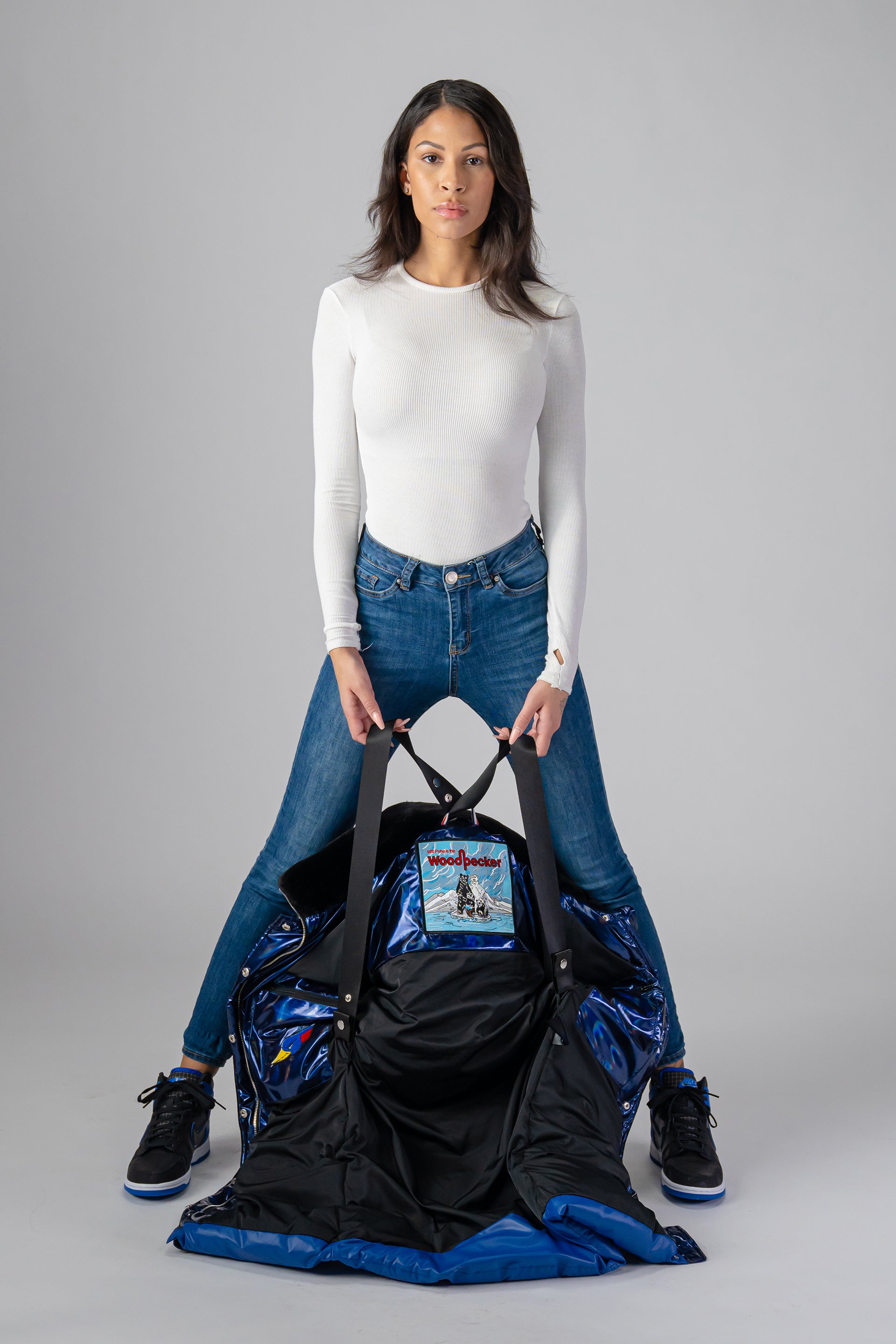 Woodpecker Women's Penguin Long Winter coat. High-end Canadian designer winter coat for women in "Oily Blue and Blue" colour. Woodpecker cruelty-free winter coat designed in Canada. Women's heavy weight long length premium designer jacket for winter. Superior quality warm winter coat for women. Moose Knuckles, Canada Goose, Mackage, Montcler, Will Poho, Willbird, Nic Bayley