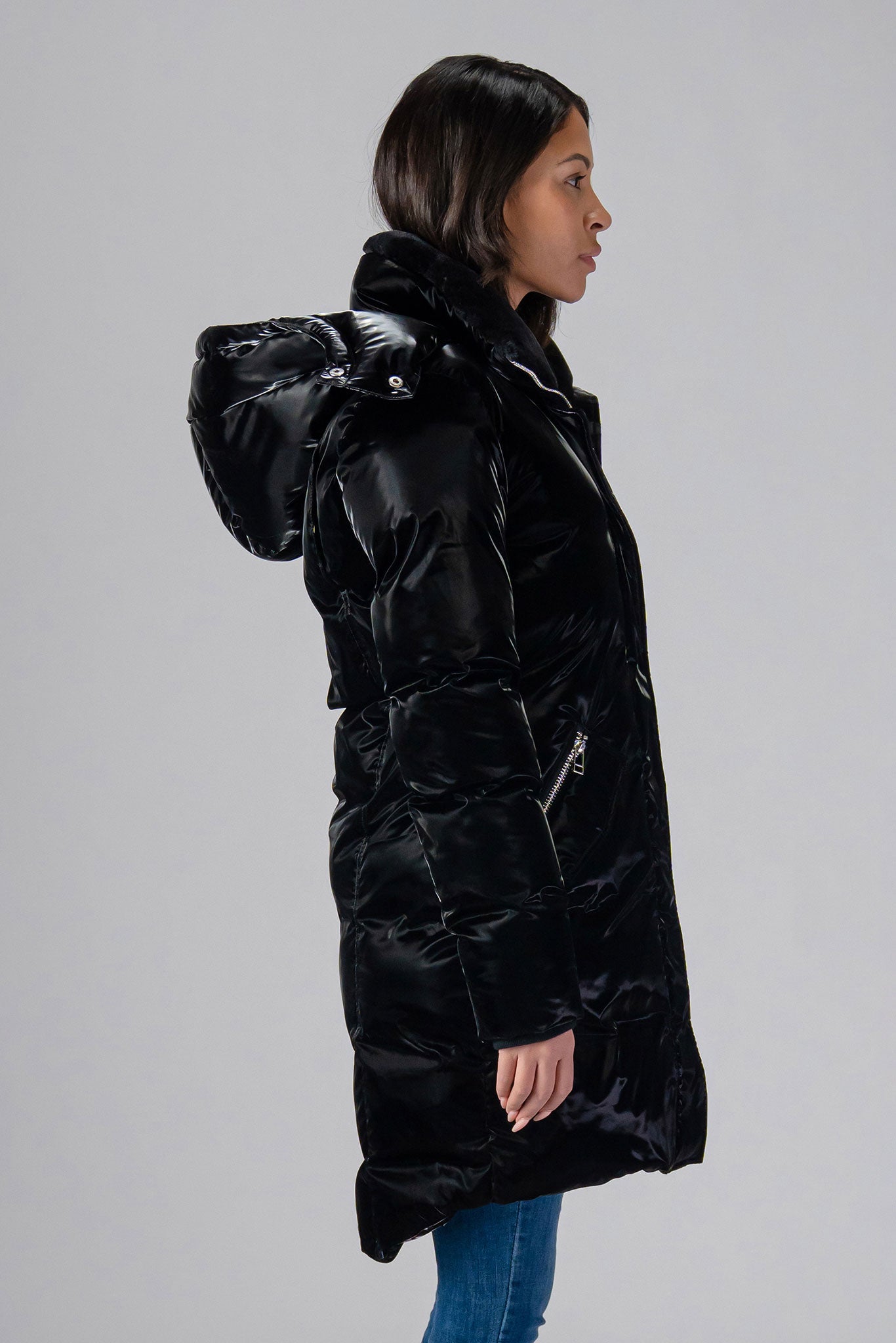 Woodpecker Women's Unquilted Penguin Long Winter coat. High-end Canadian designer winter coat for women in "All Wet Black" colour. Woodpecker cruelty-free winter coat designed in Canada. Women's heavy weight long length premium designer jacket for winter. Superior quality warm winter coat for women. Moose Knuckles, Canada Goose, Mackage, Montcler, Will Poho, Willbird, Nic Bayley. Extra warm. Shiny parka. Stylish winter jacket. Designer winter coat.