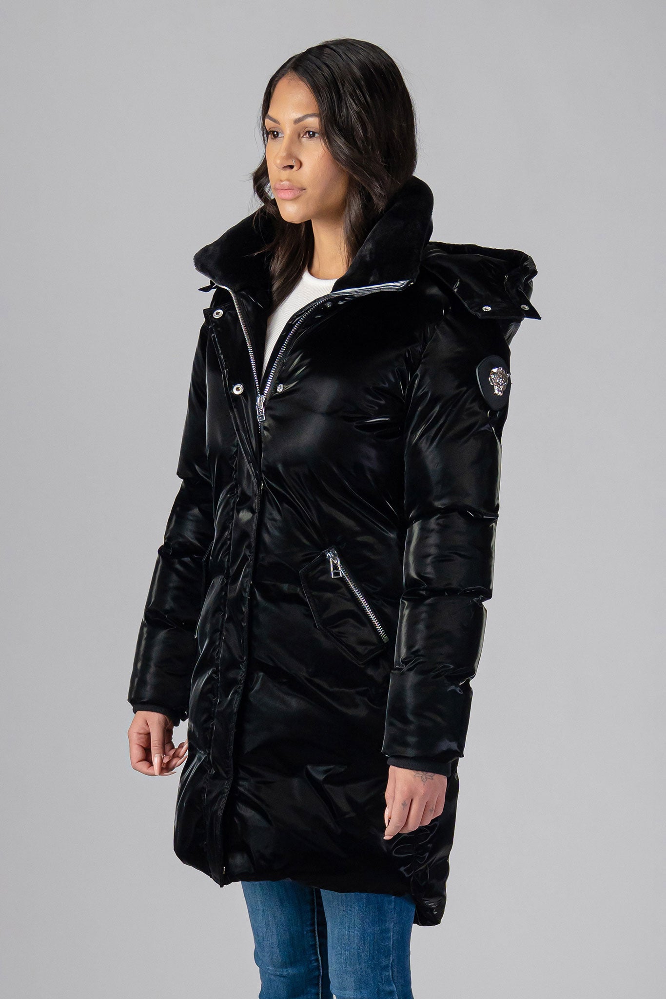 Woodpecker Women's Unquilted Penguin Long Winter coat. High-end Canadian designer winter coat for women in "All Wet Black" colour. Woodpecker cruelty-free winter coat designed in Canada. Women's heavy weight long length premium designer jacket for winter. Superior quality warm winter coat for women. Moose Knuckles, Canada Goose, Mackage, Montcler, Will Poho, Willbird, Nic Bayley. Extra warm. Shiny parka. Stylish winter jacket. Designer winter coat.