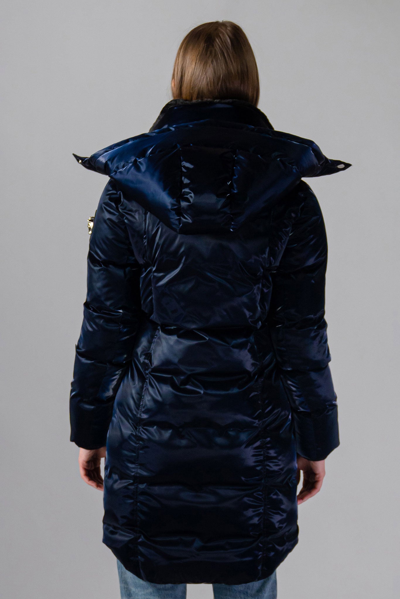 Woodpecker Women's Unquilted Penguin Long Winter coat. High-end Canadian designer winter coat for women in "All Wet Navy" colour. Woodpecker cruelty-free winter coat designed in Canada. Women's heavy weight long length premium designer jacket for winter. Superior quality warm winter coat for women. Moose Knuckles, Canada Goose, Mackage, Montcler, Will Poho, Willbird, Nic Bayley. Extra warm. Shiny parka. Stylish winter jacket. Designer winter coat.