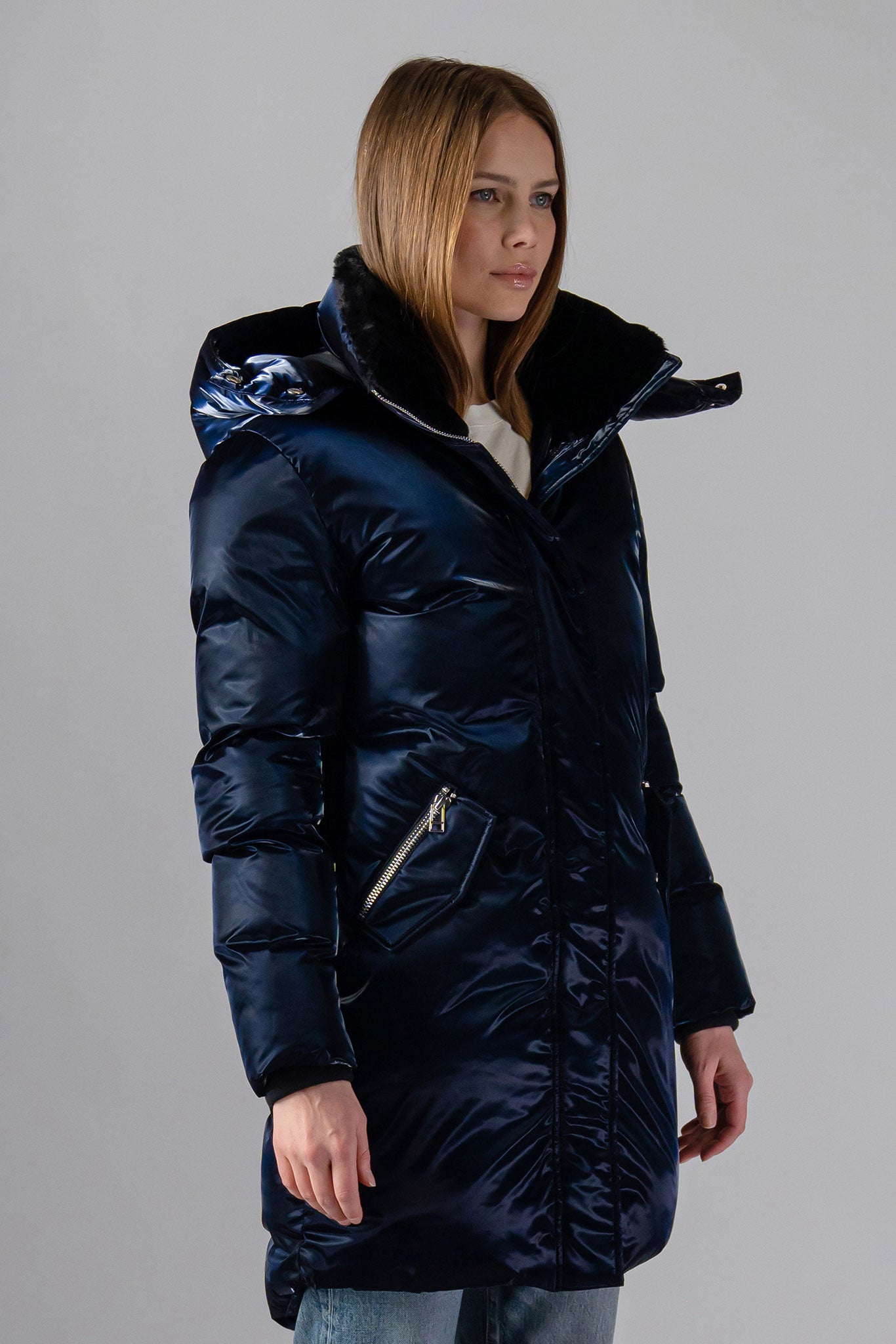 Woodpecker Women's Unquilted Penguin Long Winter coat. High-end Canadian designer winter coat for women in "All Wet Navy" colour. Woodpecker cruelty-free winter coat designed in Canada. Women's heavy weight long length premium designer jacket for winter. Superior quality warm winter coat for women. Moose Knuckles, Canada Goose, Mackage, Montcler, Will Poho, Willbird, Nic Bayley. Extra warm. Shiny parka. Stylish winter jacket. Designer winter coat.